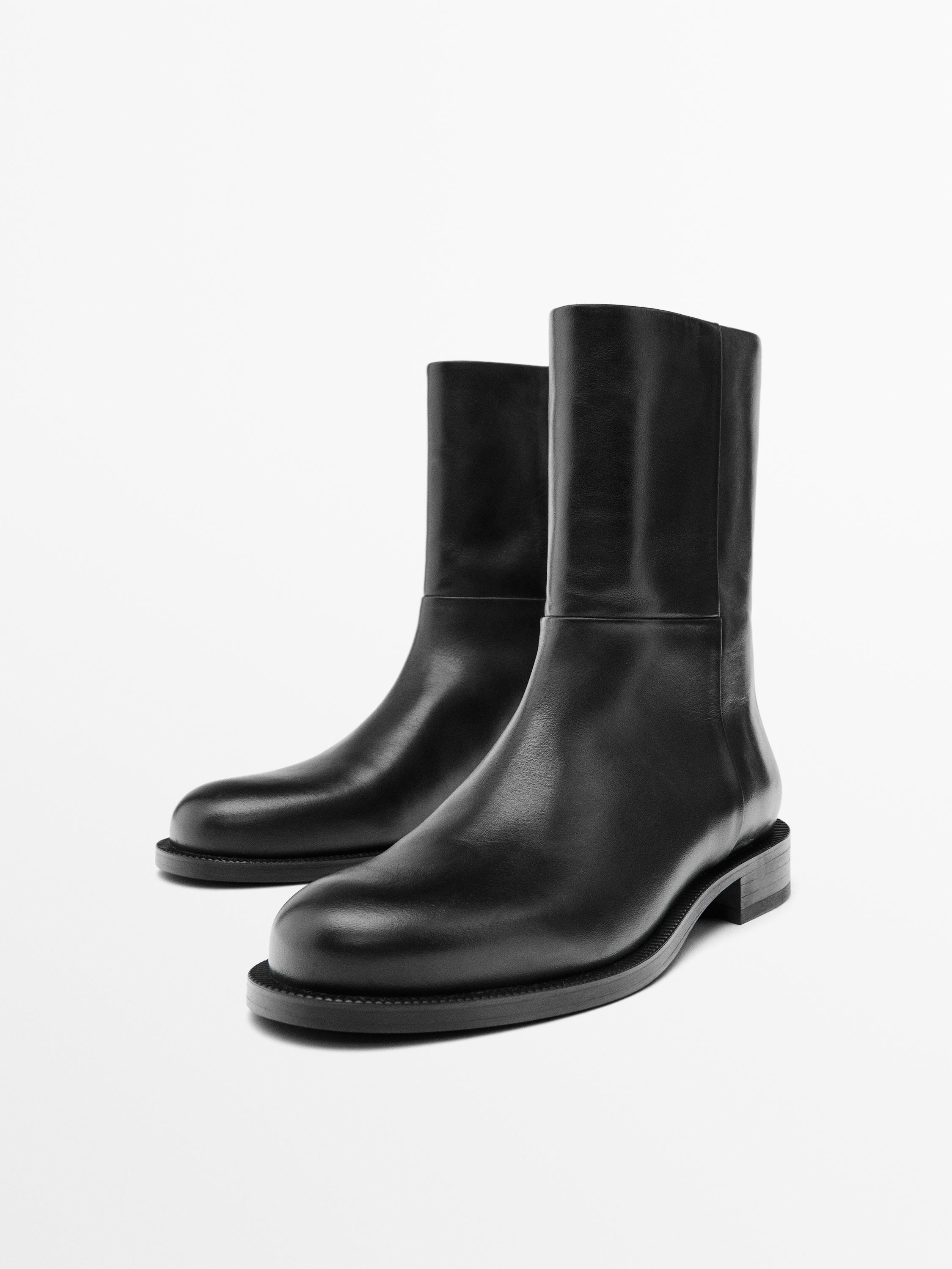 Made of cowhide leather. Leather lining and insole . Side zip fastening. Leg height: 14 cm. Leg w... | Massimo Dutti UK