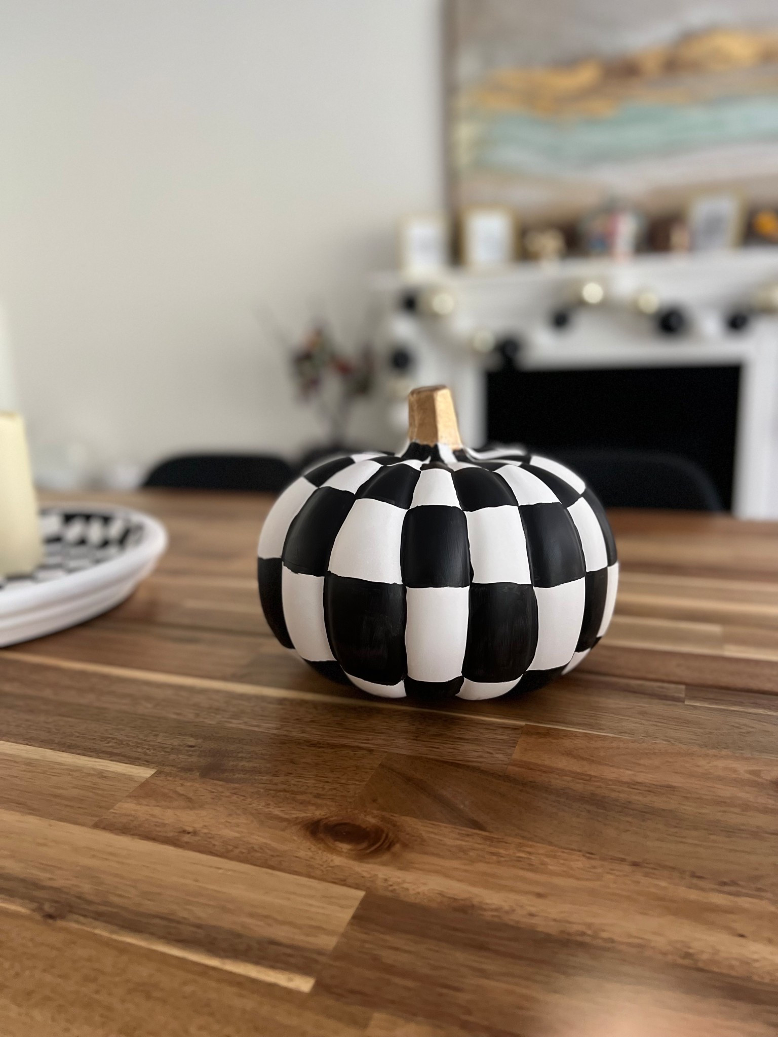 🎃 Sharing what I used for this collaboration a few years back. I painted these white craft pumpkins, and also made some DIY tier trays from terracotta clay pots and bases (then painted them checkered just like the pumpkins). 

I taped off the sections and sprayed on the paint outdoors, protected from wind in large cardboard boxes. I was obsessed with the final outcome & still am. So fun! 🖤

#LTKHome #LTKFamily #LTKSeasonal