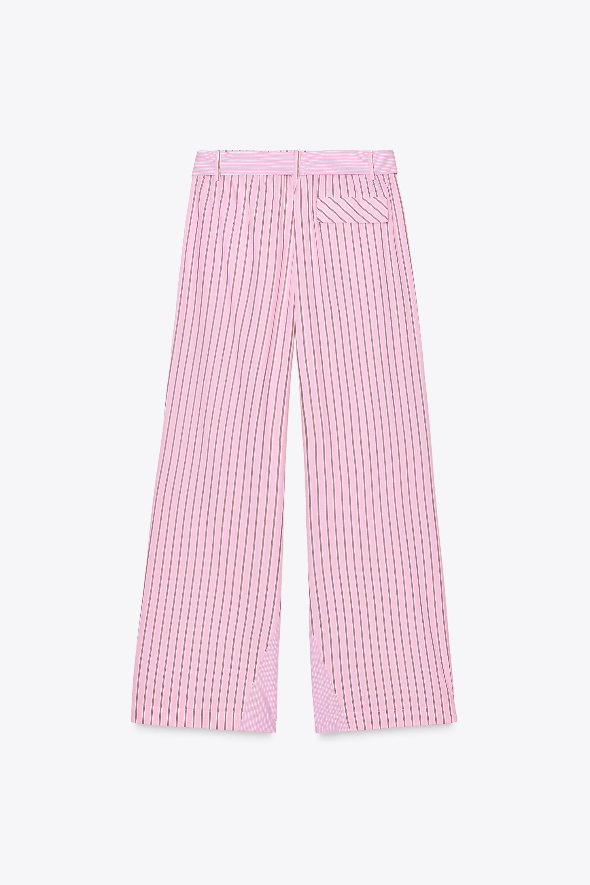Mid-rise pants with belt loops and elastic waistband. Side pockets and a false flap pocket at bac... | Zara US