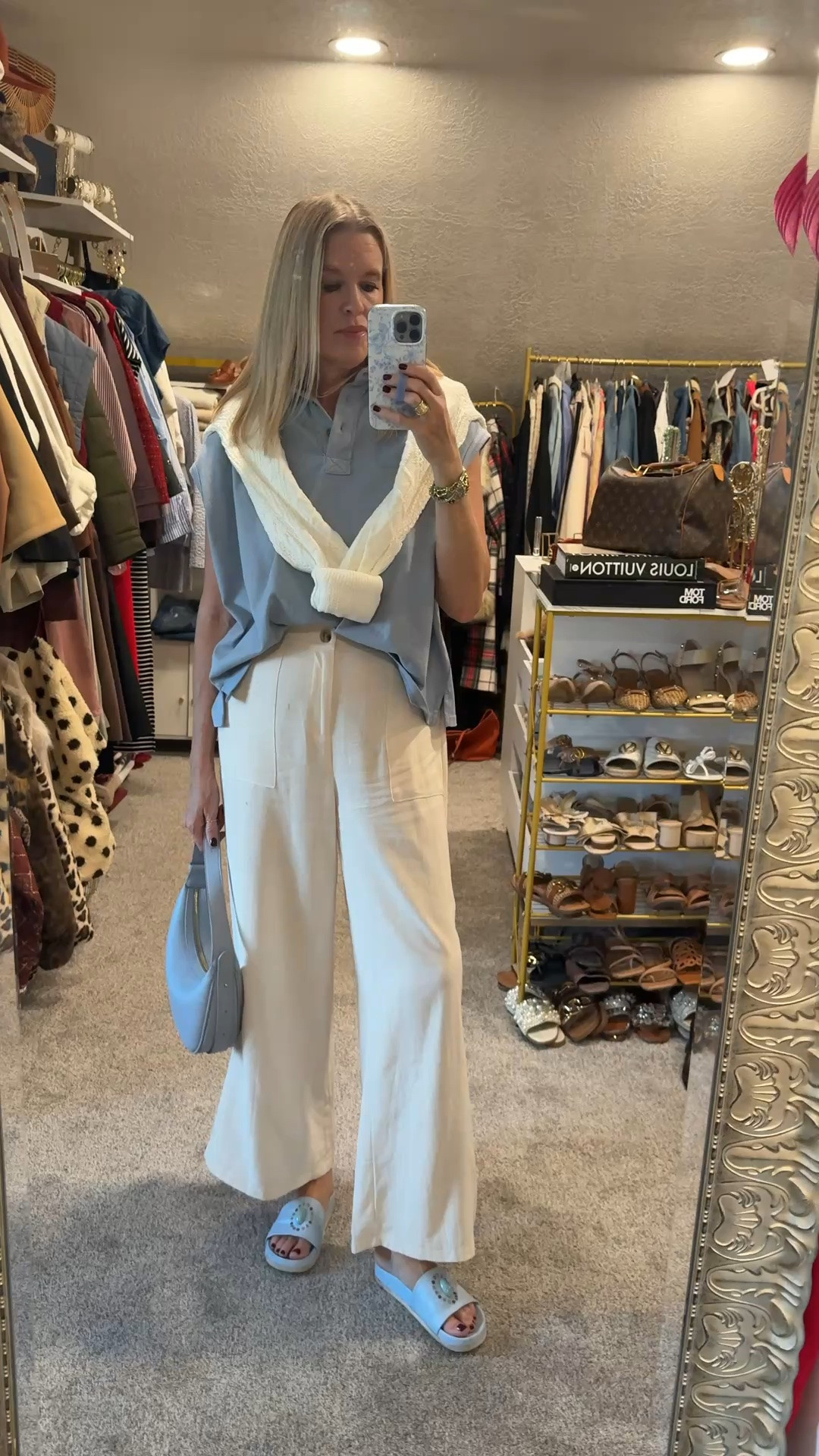 Easy and comfortable outfit .. yet chic and very affordable 

Boxy cap sleeve polo shirt … comes in several colors  tts 

Ivory sweater over shoulder tts 

The best pull on trouser pants with button front detail and wide leg with pockets… super comfy and flowy yet .. affordable and classic looking 
Comes in several colors tts 

Cute designer inspired blue bag that matches shirt and ties everything together 

Blue Madison Masion slide sandals that are so comfy

#LTKootd #LTKgrwm #LTKOver40