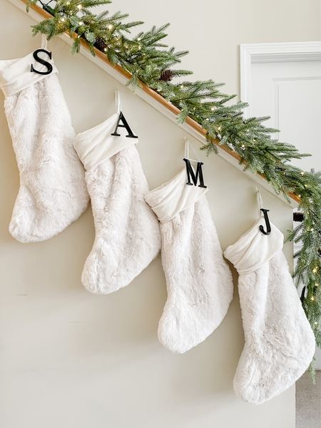 No mantle, no problem! This year I used greens with battery operated lights to create our Christmas stocking display along our stair railing. 

#LTKSeasonal #LTKHoliday #LTKhome