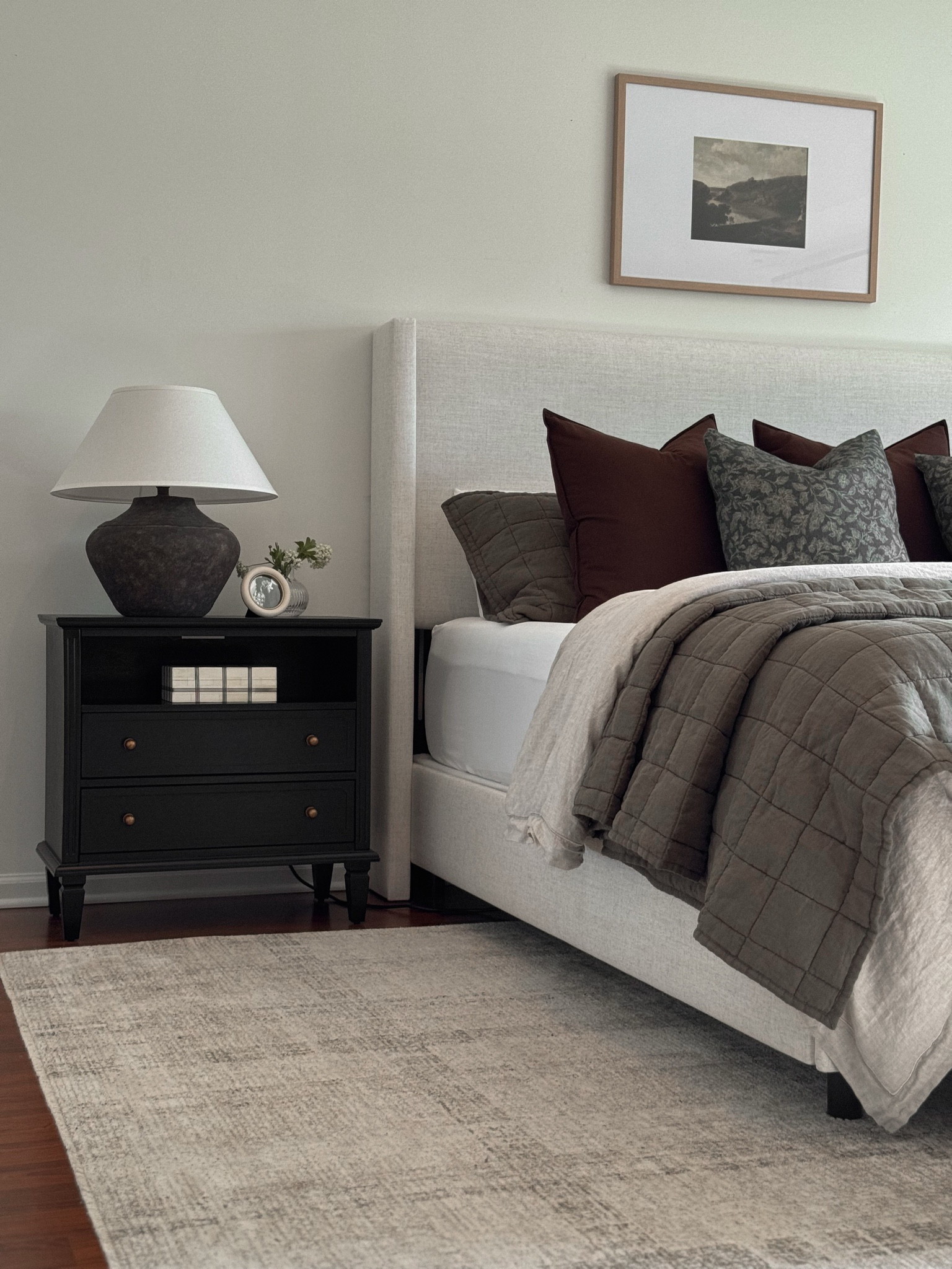 Bedframe, bedding, moody bedroom, bedroom rug, nightstand, nightstand decor, nightstand lamp, table lamp, upholstered headboard, art above bed, throw pillows

#LTKHome