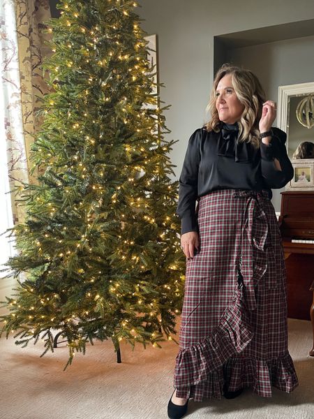 An iconic classic Christmas skirt! You’ll wear it year after year. It reminds me of my mom. Her beautiful classic style. If you have a wedding to attend in December…fabulous. Christmas Eve open house? This is it. It runs a little large but I stayed tts as it’s a wrap and I liked that it provided full coverage underneath. The plaid is a deep forest green red and a little cream  

Linking several top options. 

#LTKwedding #LTKHoliday