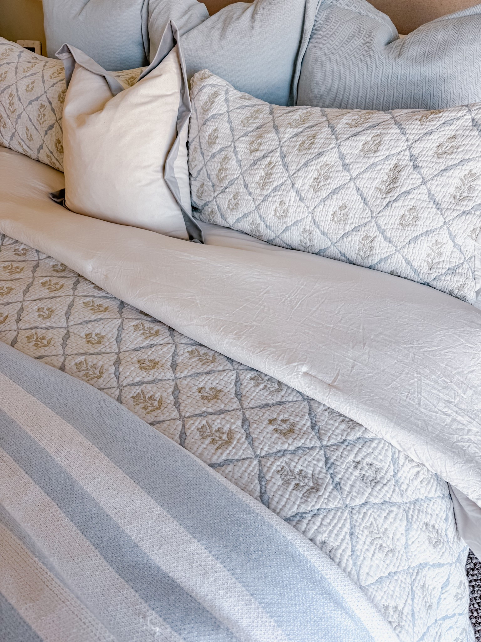 Spring bedding refresh // florals // blue // green // coastal // primary suite // master bedroom // home decor // throw blanket 

#LTKHome #LTKSaleAlert #LTKSeasonal