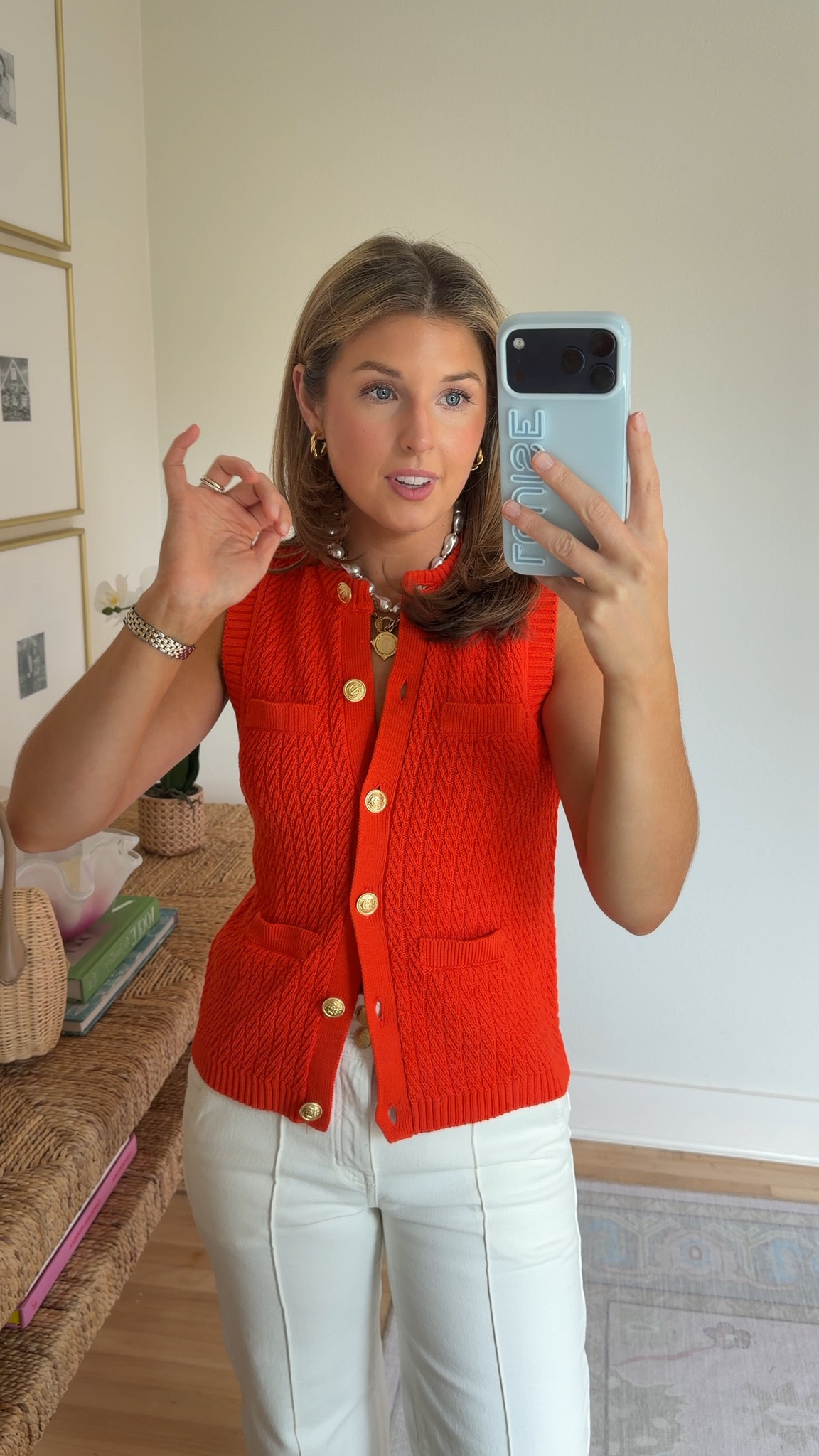 Poppy orange knit vest! Wearing an XS. Wearing 26 in jeans