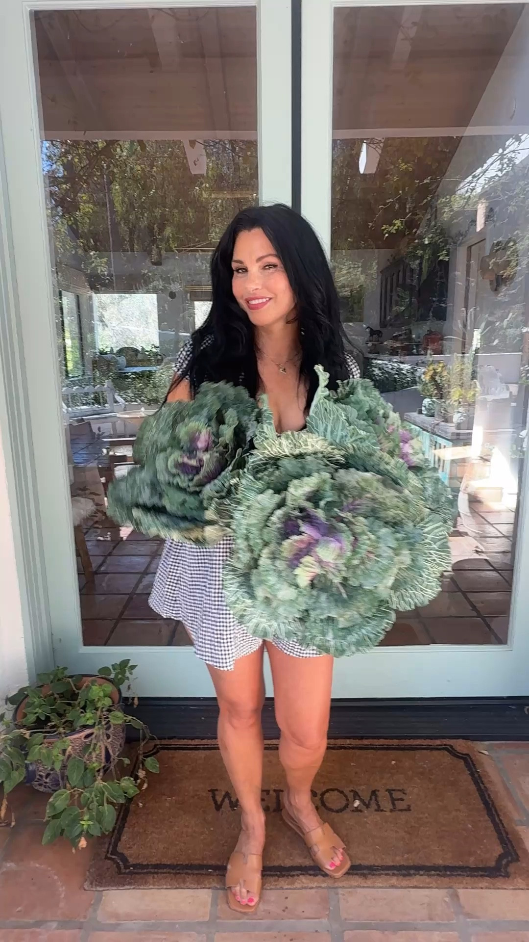 My DIY Outdoor Planter Hack! 🌿🌸

I mix artificial flowers along with live plants into my outdoor pots. These faux flowers look so real and are so easy to care for!😜 (ha,ha)

Doing it all while wearing my Cute Gingham Romper.🤍

This black and white checked romper is so easy to wear. It can be worn as a casual daytime outfit with camel color flats or dressed up for a date night with black heels and a black leather jacket. 

#gingham #slides #marneystidbits #summerstyle #resortwear2026

#LTKvlog #LTKootd #LTKSaleAlert