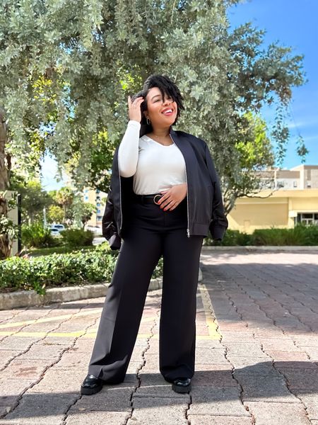 Loving my latest church OOTD. Simple but chic and comfortable. This off white relaxed long sleeve v-neck tee paired well with my relaxed mid-rise wide leg black trouser pants. I decided paired it with my mom shoes, my chunky black patent leather loafers and threw on this black bomber jacket to complete the look!

My scent of the day was Sol de Janeiro #62 body wash, lotion and spray layered with J’adore. I received so many compliments. 

This entire look would work well for an office as well. 

I’m wearing a size medium in the top and 14 long in the pants (I love when my pants cover my shoes).

#LTKsalealert #LTKstyletip #LTKmidsize