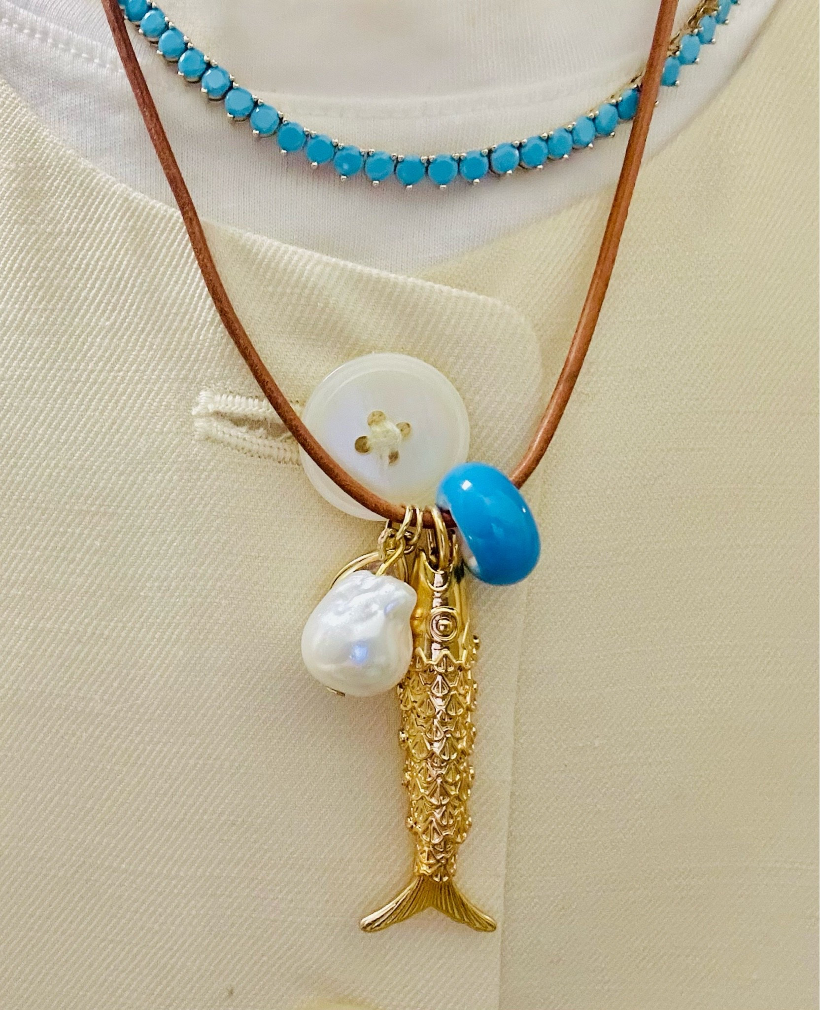 A good stack. The fish necklace is on sale.

#LTKSaleAlert