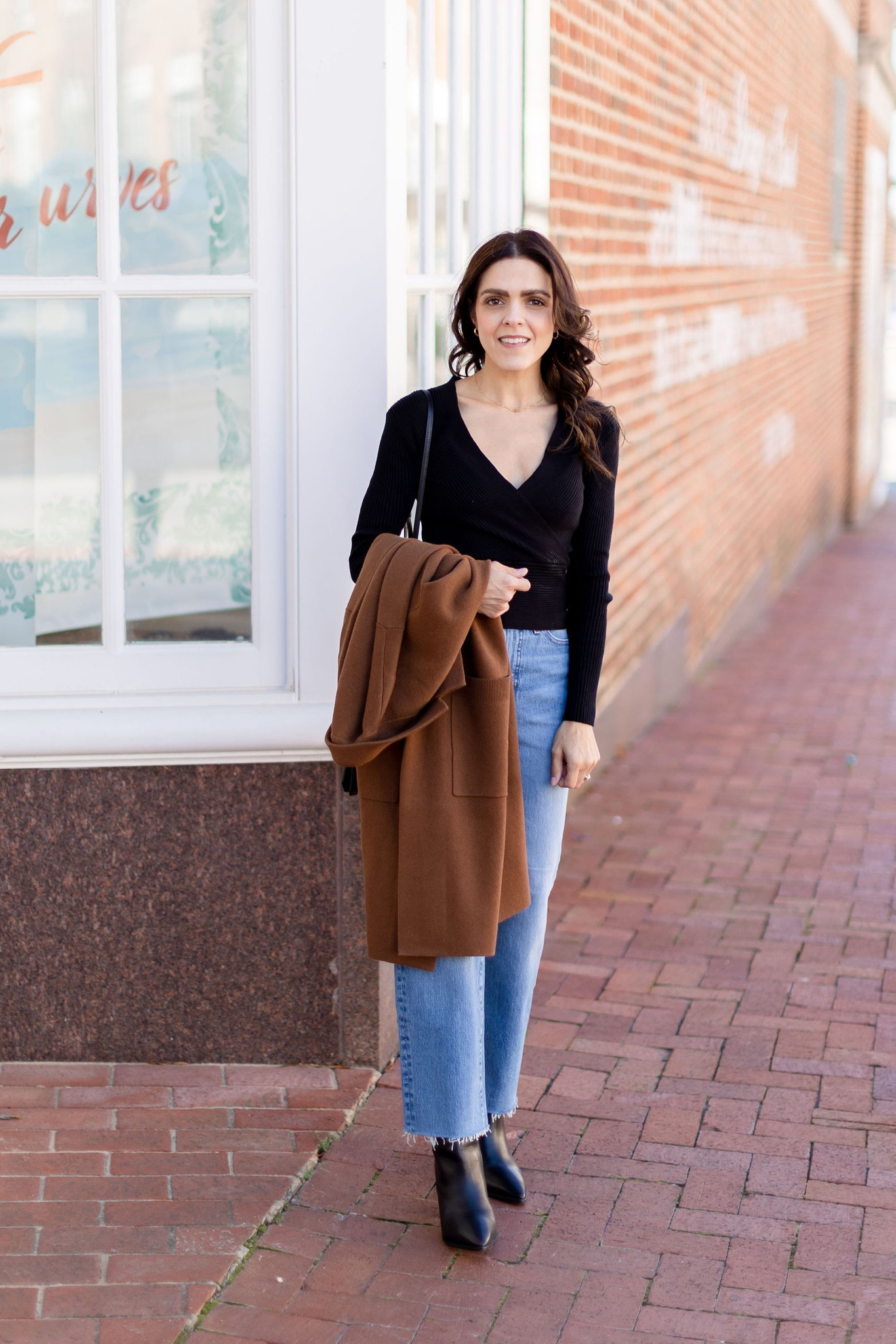 Thanksgiving outfit idea: black wrap sweater, high rise wide leg Jean, black boots, long sweater coat 

#LTKstyletip