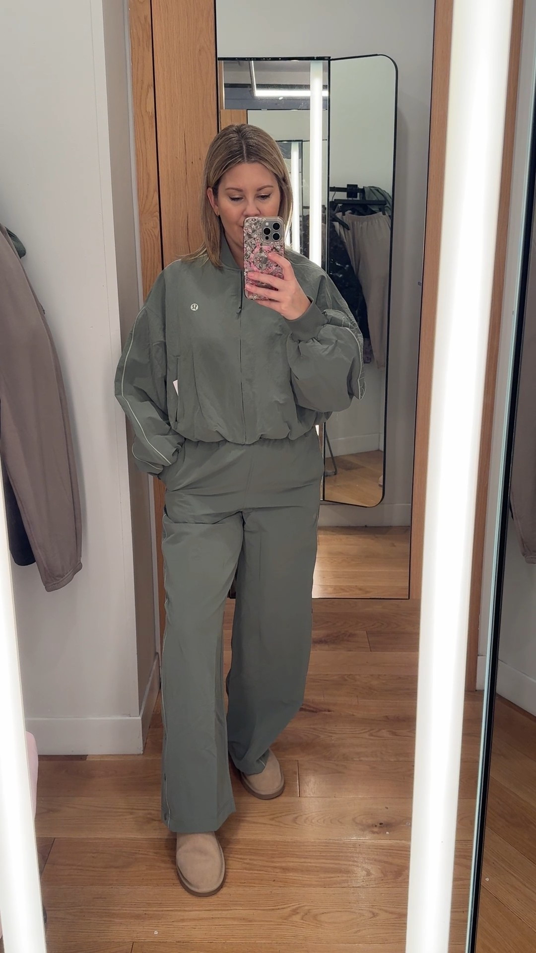 This is one of those love-it-or-not-your-style athleisure sets.

The jacket is actually really cute — lightweight, relaxed, and easy to throw on. I’m wearing a size small, true to size, and I’d personally wear this on its own with leggings all the time.

Underneath, I’m wearing a long sleeve top in a size 4, true to size. These are my absolute favourite basic tops — super soft, comfortable, and easy to layer.

The pants are also true to size (size small), but for me they feel a bit overwhelming, especially worn with the jacket together. Totally a personal preference — if you like a loose, relaxed, sporty fit, this set makes sense, it’s just more volume than I usually go for.

A casual athletic look that works well for errands, travel, or athleisure days.

athleisure outfit, casual outfit, everyday outfit, travel outfit, winter outfit, spring outfit, relaxed fit outfit, sporty outfit, athletic wear, lightweight jacket outfit, track jacket outfit, track pants outfit, athleisure set, casual athletic outfit, loose fit pants, comfy outfit, long sleeve workout top, long sleeve, basic tops, layering outfit, ugg microboot outfit, cozy boots outfit

#LTKcanada #LTKfitness #LTKwinter