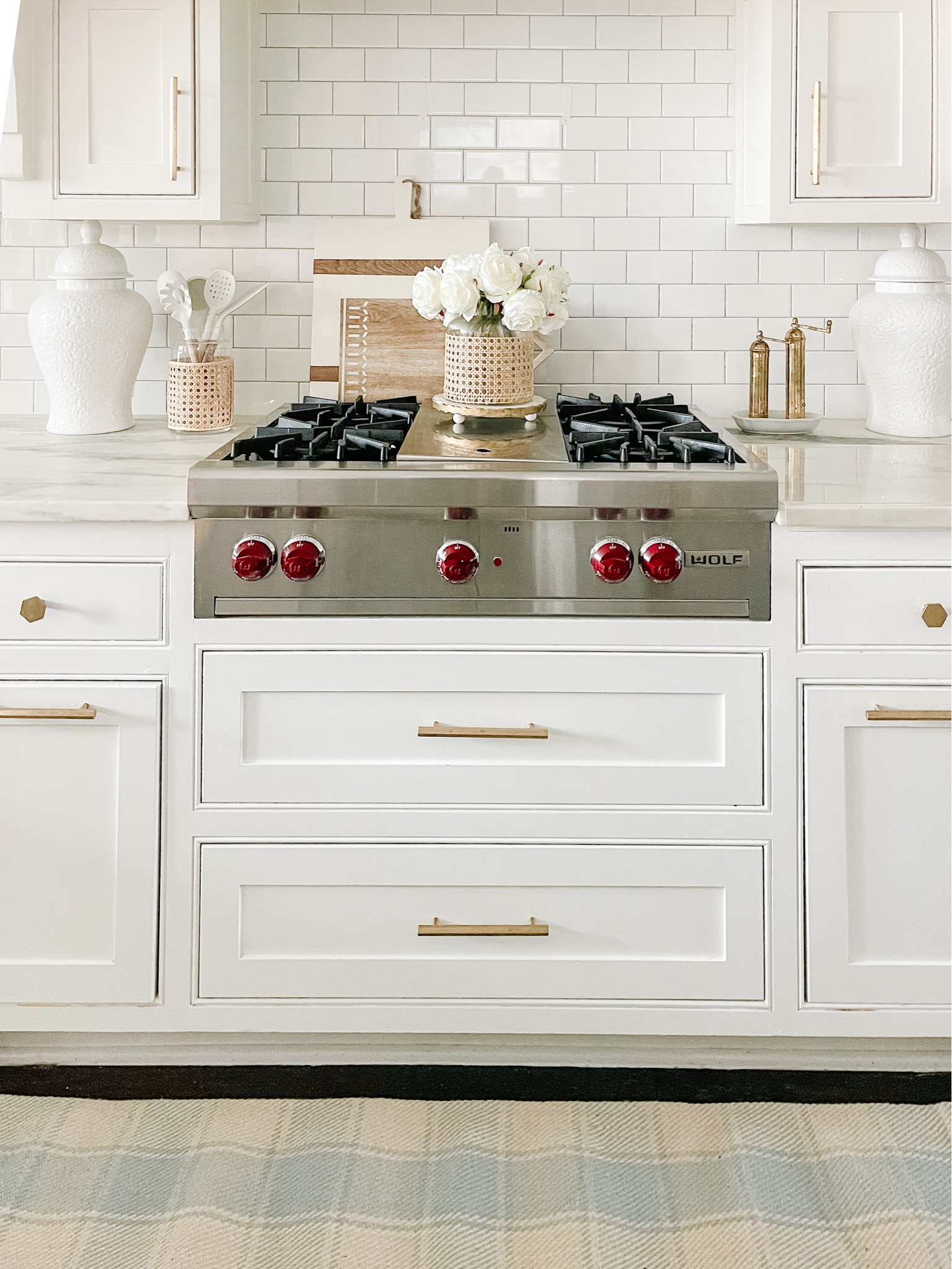 Coastal kitchen decor! Faux white peonies in cane vase. Gingham rug runner.



#LTKhome #LTKstyletip #LTKSeasonal