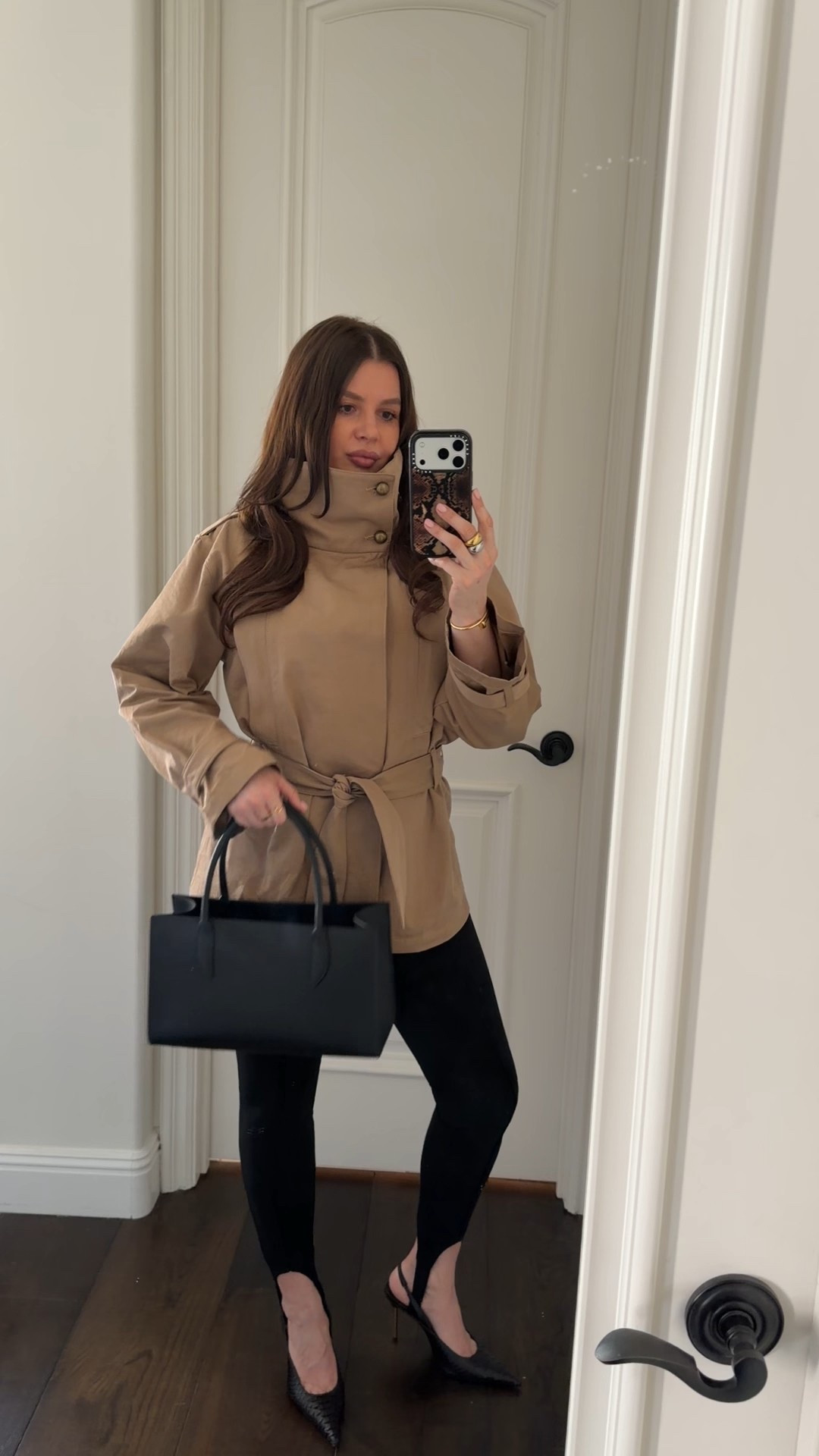 Styling a funnel neck trench coat with black leggings, black sling backs and a small black leather tote. Adding gold jewelry to elevate the look. 

#outfitidea #outfitinspo #highneck #funnelneck #springoutfit #trenchcoat #leggings #tote #zara #revolve 

#LTKgrwm #LTKWorkwear #LTKootd
