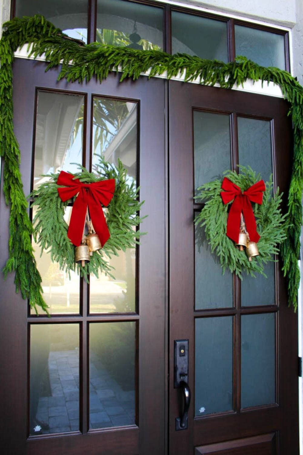 Christmas front porch Norfolk Wreaths. Norfolk garlands on a budget. Big red bows from Walmart! #Christmas #LTKfind

#LTKSeasonal #LTKHoliday #LTKHome