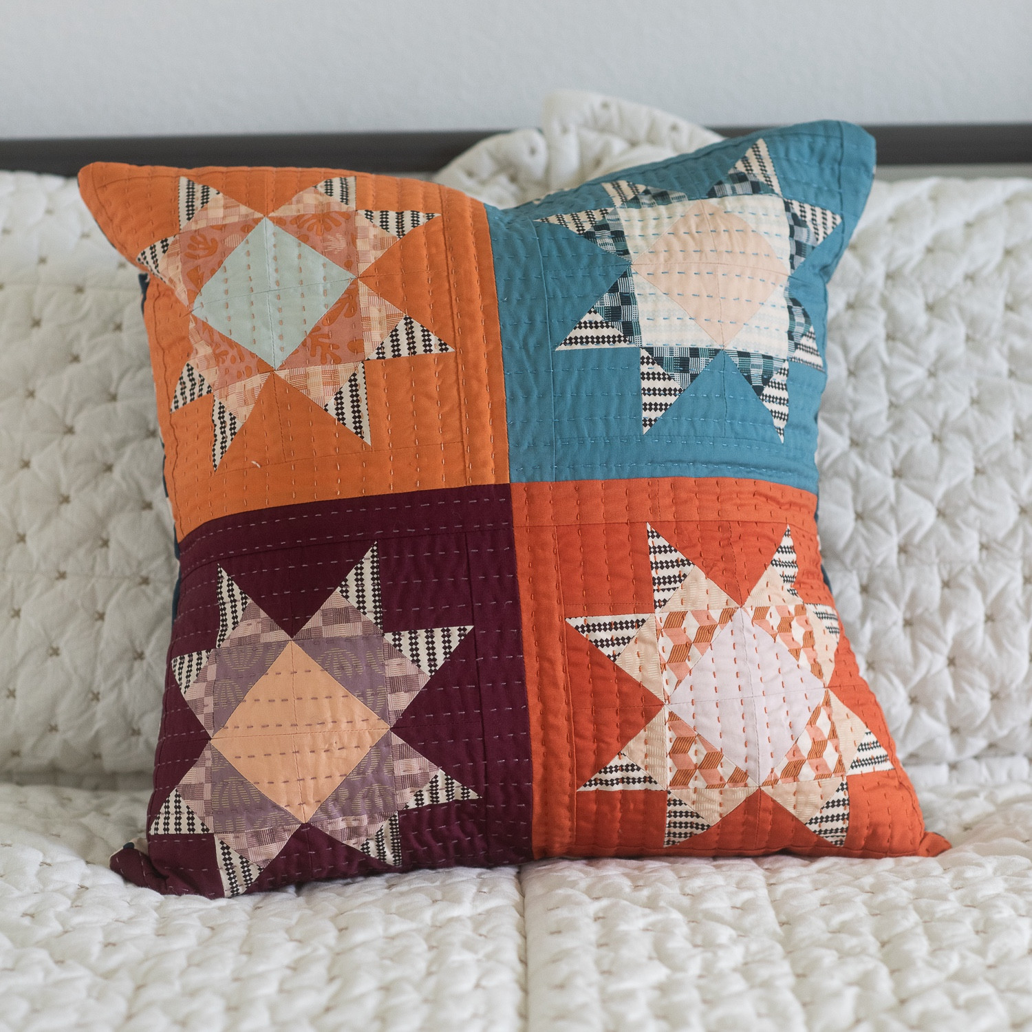 Stripey Stars Mini made with Duval +art gallery pure solids.  Hand quilted using the new Aurifil 8 wt thread set.  