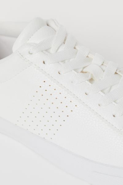 Sneakers in faux leather with lacing at front and lightly padded edge and tongue. Mesh lining, fa... | H&M (US + CA)