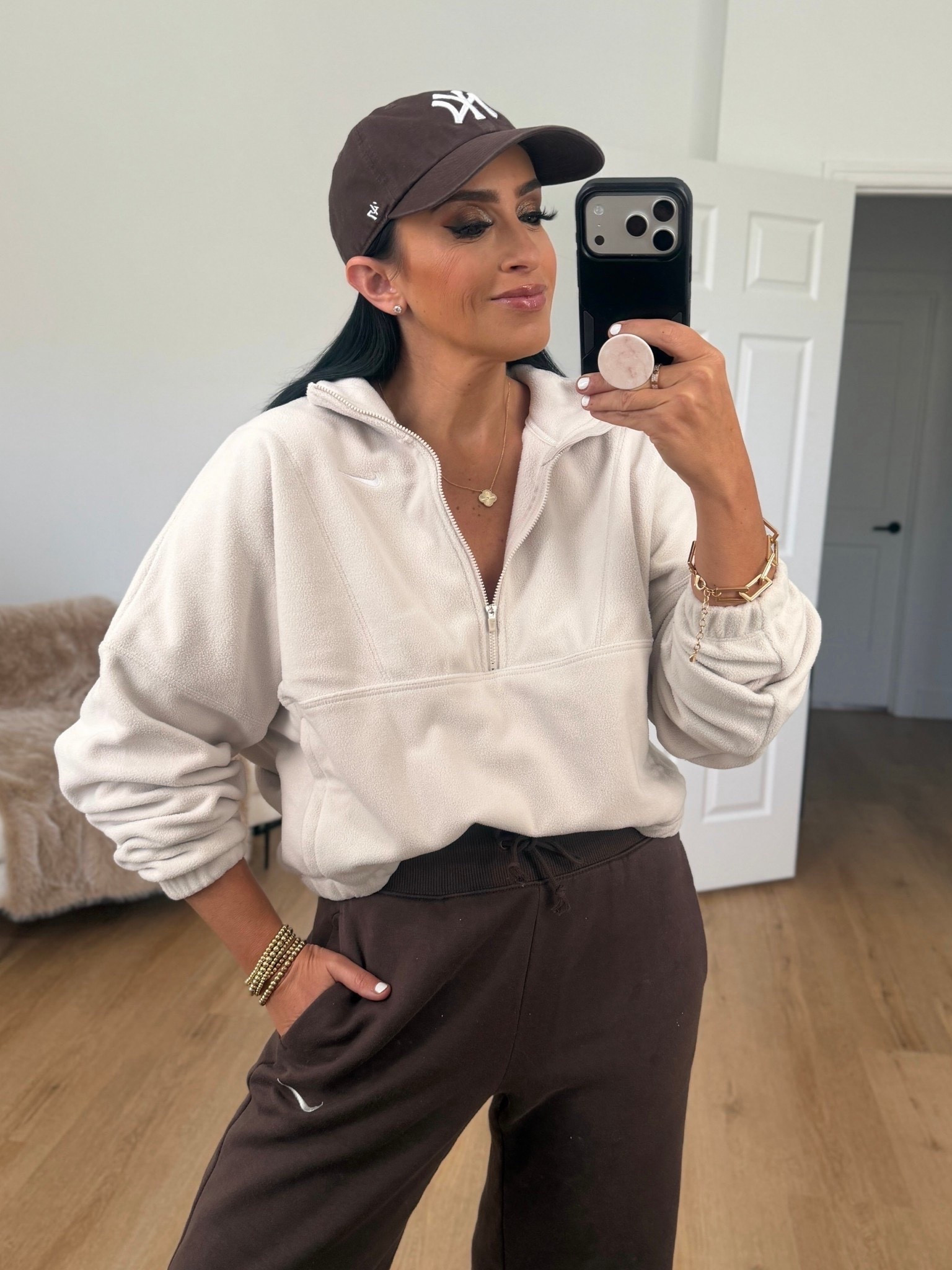 Nike One Women's Therma-FIT Oversized 1/2-Zip Fleece Top wearing size small. Nike Sportswear Phoenix Fleece Women's High-Waisted Wide-Leg Pants wearing size medium.