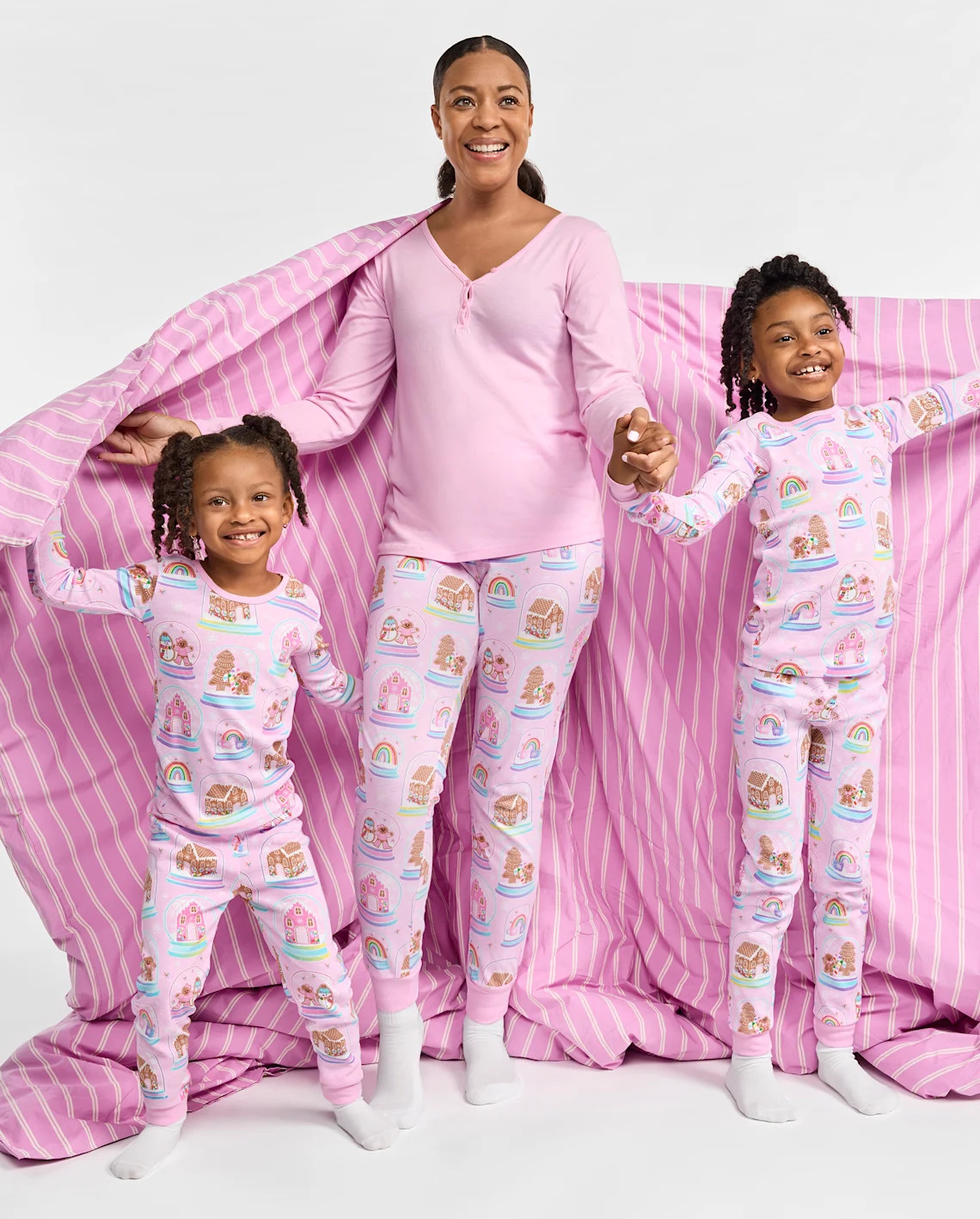 Our Gingerbread House Collection features matching pajamas for Mom and her girls. | The Children's Place