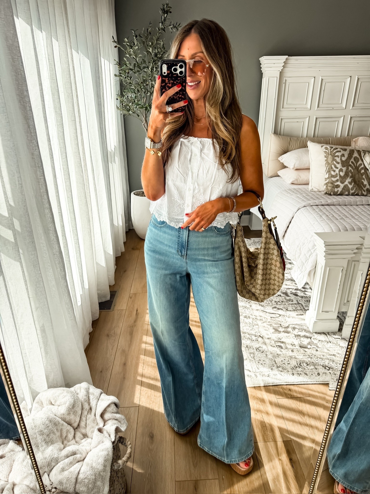 The top that instantly elevates your denim 🤍This blouse is so feminine and detailed, it makes even a simple pair of jeans feel styled. Paired with these wide leg jeans for that flattering, elongating fit. Easy, pretty, and perfect for everyday

white blouse outfit, wide leg jeans, elevated casual, feminine style, everyday outfit idea, effortless chic, themominstyle 

#LTKSeasonal #LTKOver40 #LTKootd