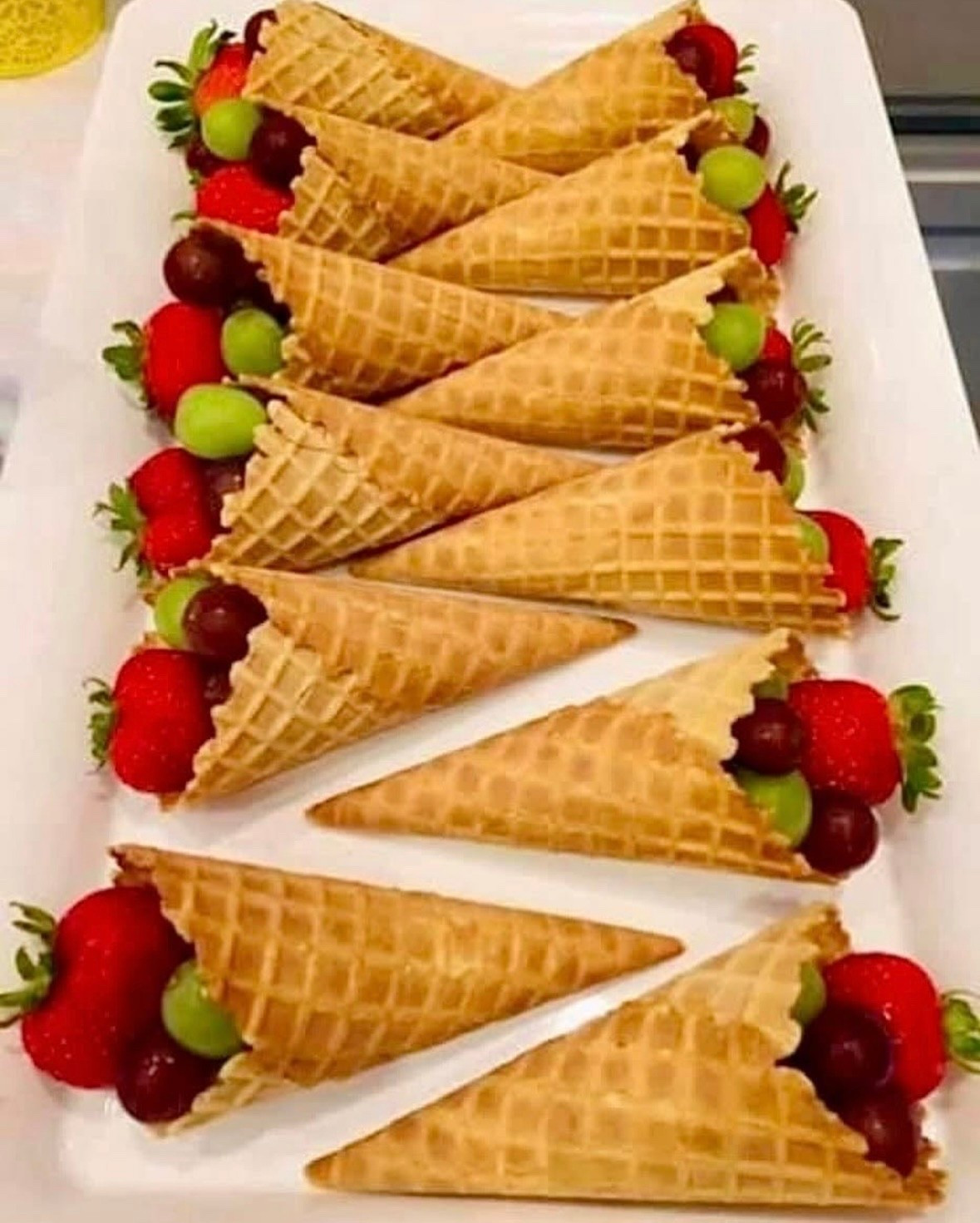 A fun idea for a party! Add strawberries, red grapes, green grapes and other fruit inside of a waffle cone and serve! You may also want to add a little chocolate. 

#LTKWedding #LTKParties #LTKFamily