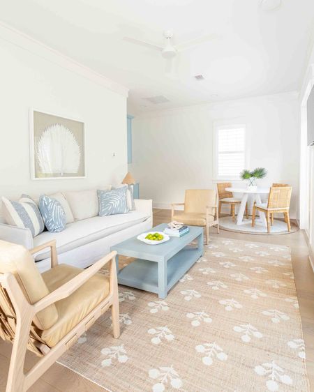 Our Florida carriage house living room features a slipcovered indoor/outdoor sofa, light leather chairs, block print rug, a light blue coffee table, scalloped rattan lamps, round side tables, oversized palm art, and light blue tropical pillows! Take the full tour here: https://lifeonvirginiastreet.com/our-florida-carriage-house-tour/. 

. coastal living room decor, Serena & Lily style, coastal grandmillennial, coastal grandmother aesthetic

#ltkhome #ltkseasonal #ltksalealert #ltkfindsunder50 #ltkfindsunder100 #ltkstyletip #ltktravel #ltkover40   

#LTKSaleAlert #LTKSeasonal #LTKHome