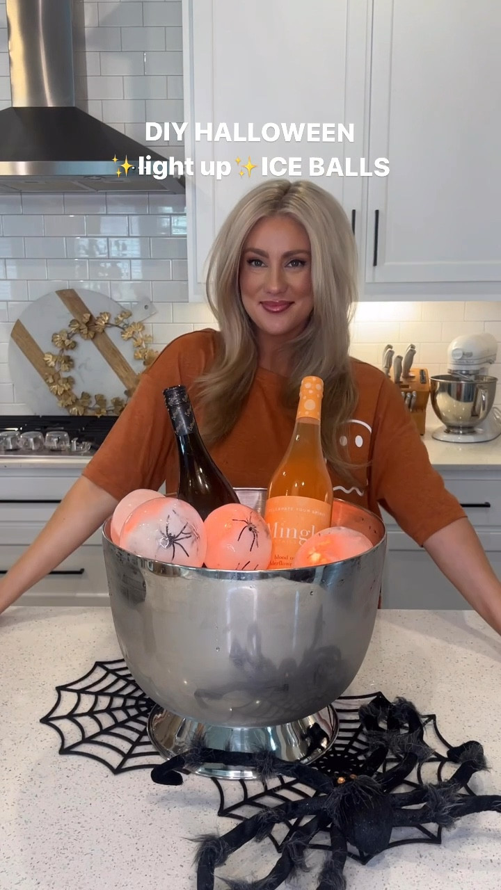 DIY HALLOWEEN ICE BALLS that light up!
Instructions:
1. make a small ball out of spider web, plastic spiders & 1 LED water submersible light.
2. stretch out a balloon and carefully stuff this creation. I found the 4 spiders is max you want to add without poking into the balloons and causing a hole.
3. Fill the balloon with water until it’s your desired size, let out any air that’s gathered at the top, tie your balloon. 
4. Place your balloons in the freezer over night and do not lay them on top of each other.
5. Once the ice balls are frozen, cut the balloons so they peel off and run them under water quickly for a clearer appearance. 
6. Next I added a few solid balls to the bottom of my bucket as filler with waterproof balloon lights but this step isn’t required. 
7. Arrange the balls in an ice bucket and use the remote that came in your LED light pack to turn on the lights any color you want! ✨BAM🎃✨

Follow for more party and holiday ideas!


#LTKParties #LTKVideo #LTKSeasonal