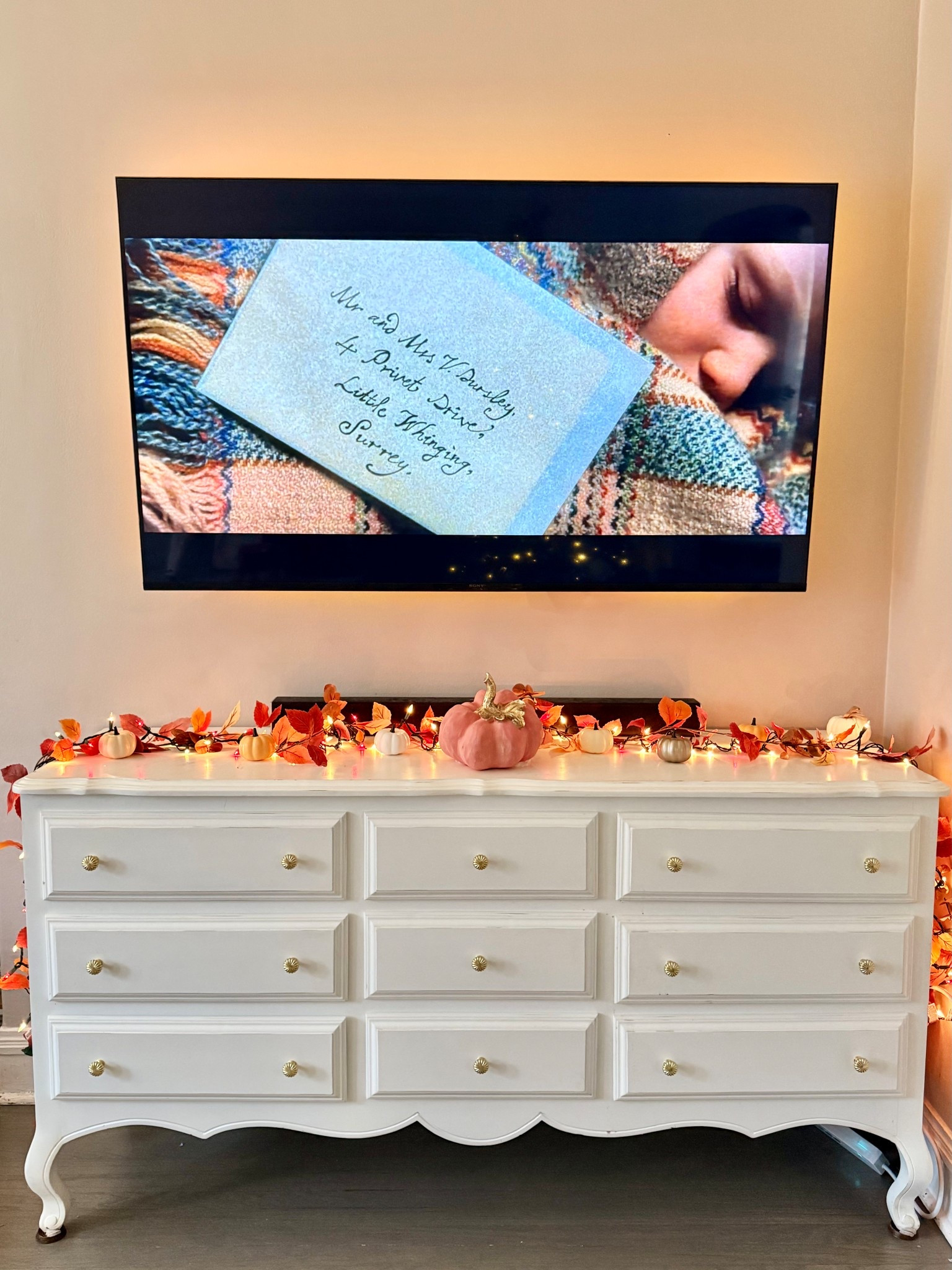 Ready for Thanksgiving! Cute fall decor for the living room. I love this white vintage dresser below our tv, decorated with a fall garland with leaves, red and white Christmas lights, and pumpkins! The backlight makes it all even better. Cozy feels!

#thanksgiving #thanksgivingdecor #falldecor #pumpkins #dresser #white #neutral #red #orange #autumndecor #techgifts #target #targetfind #trend #trending #loveshackfancy #gold #ltkfindsunder100 #ltkfindsunder50 #amazon #amazonfinds #thanksgivingdecorations #decorations #dresser #whitedresser #tvstand #garland #cute #ltkdayinmylife

#LTKCyberWeek #LTKHoliday #LTKSeasonal