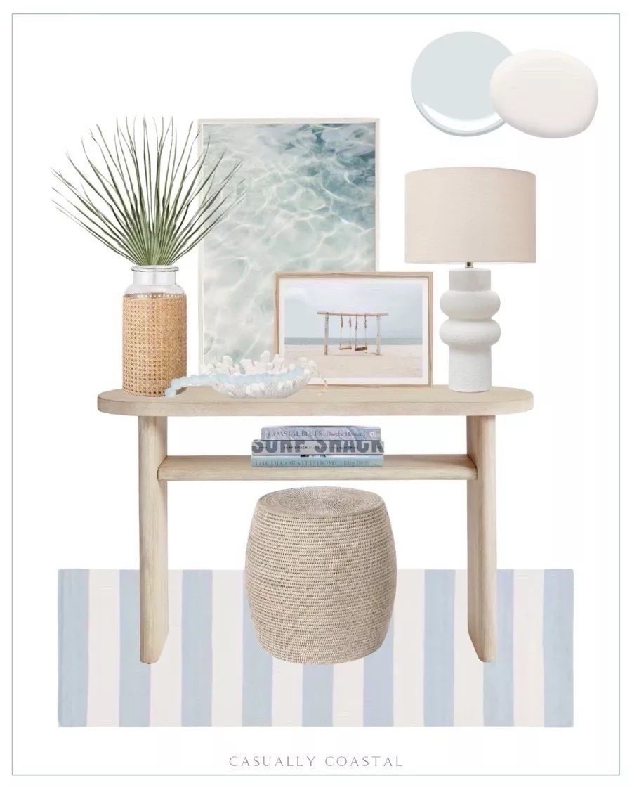 Entryway styling idea! Paint colors are Benjamin Moore Silver Cloud & SW Snowbound. 
----------- 
Coastal home decor, coastal entryway decor, coastal console table, coastal style, beach house decor, beach home style, coastal rug, coastal lamp, Amazon lamps, white lamps, coastal plants, faux plants, palm stems, coastal artwork, coastal coffee table books, Amazon coffee table books, decorative books, Amazon decorative books, decorating book, glass beads, coastal decorative glass beads, seaglass beads, rattan accent stool, woven stools, striped rug, entryway rug, hallway runner, blue & white rugs, affordable rug, Amazon lamp, table lamp with linen shade, coral textured decorative bowl, Amazon decorative bowl, Amazon home decor, Mexican fan palms, palm stems, summer florals, glass vase, coastal vase, cane vase, beach swing print, coastal wall decor, coastal artwork, ocean waves art print, neutral console table, foyer table, foyer decor console table with shelf, light wood console table, pottery barn console table, summer home decor, home accessories, foyer ideas, entryway ideas 

#LTKFindsUnder50 #LTKFindsUnder100 #LTKHome