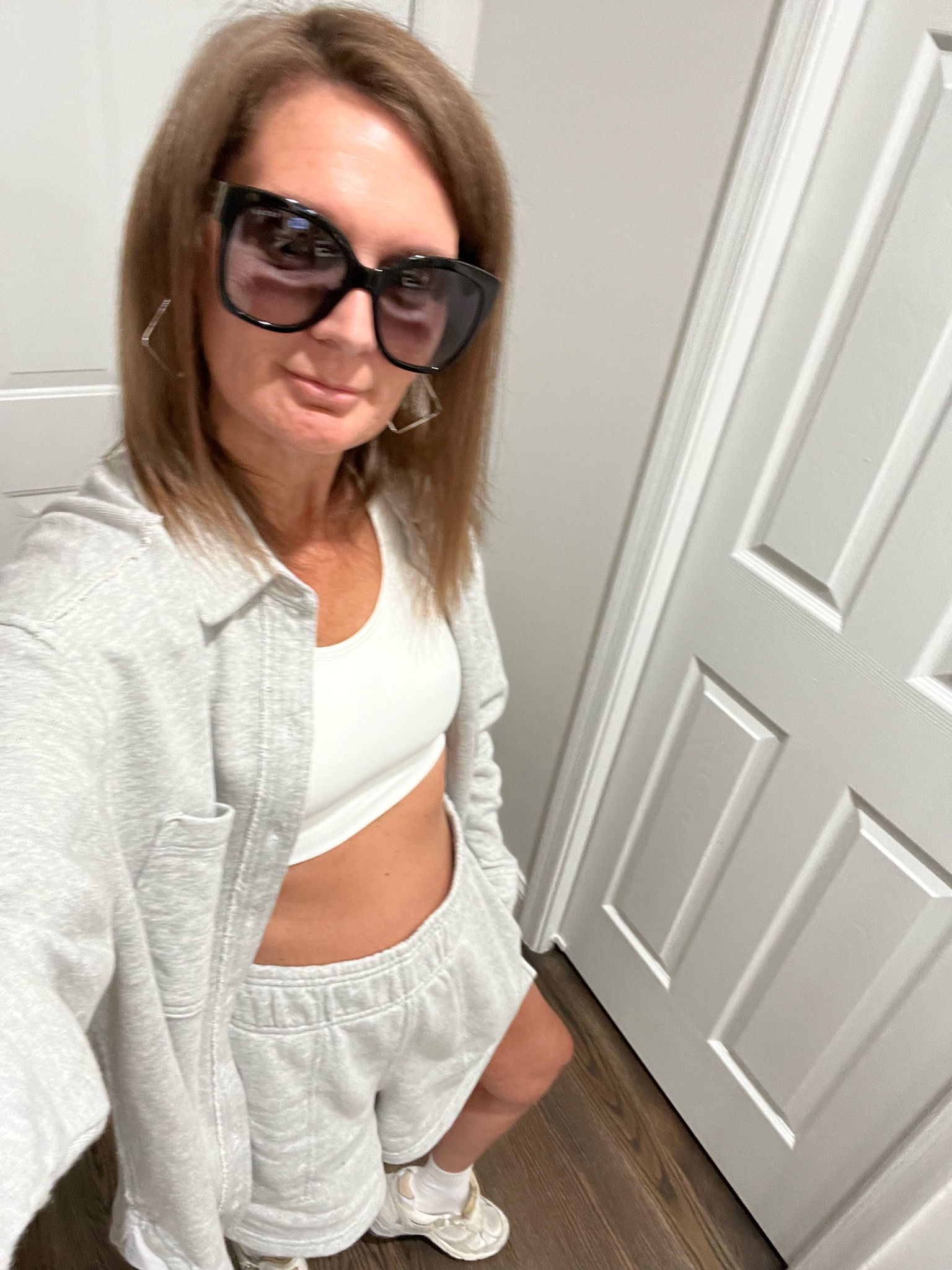 Aerie high waisted fleece shorts, Aerie fleece button up shirt, Target All in Motion white  sports bra, Dad Star Golden Goose sneakers, American Eagle socks, Uncommon James silver earrings and Gucci sunnies. 

#LTKfindsunder50 #LTKover40 #LTKstyletip