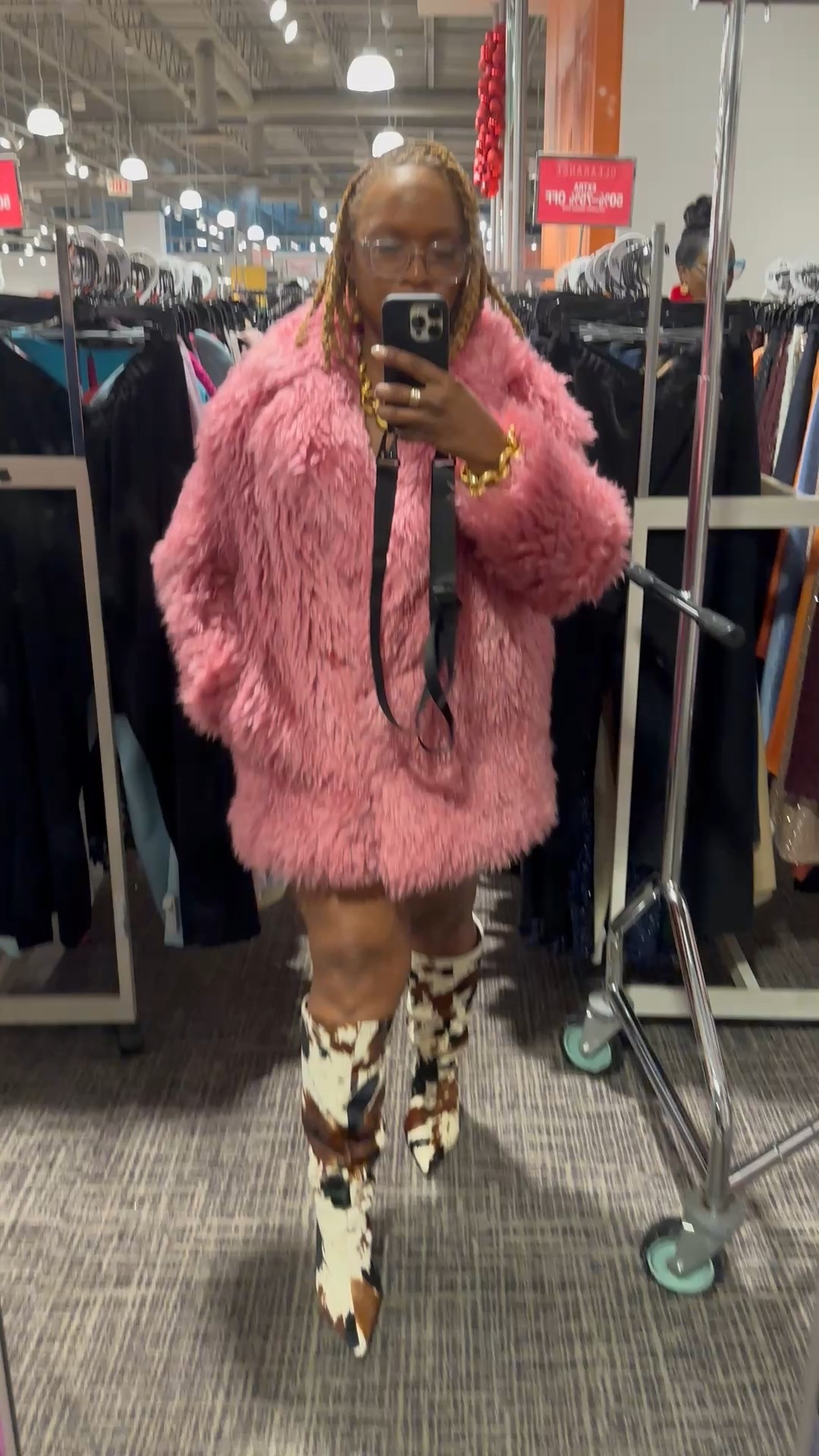 Cow print boots and pink faux fur coat 

#LTKSeasonal #LTKOver40 #LTKFindsUnder100