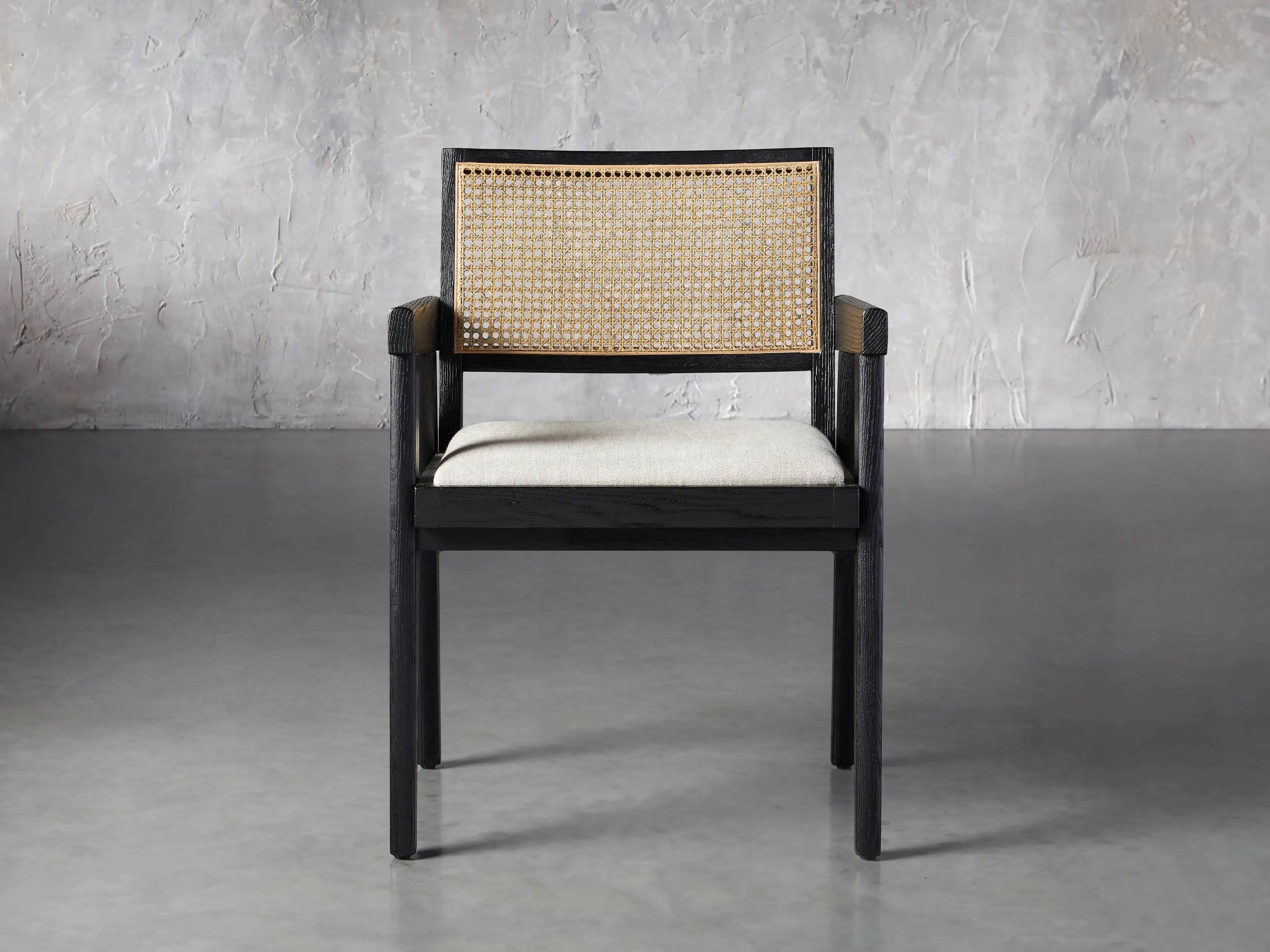 Kroy Cane Back Arm Chair in Black Drifted with Natural Linen seat | Arhaus