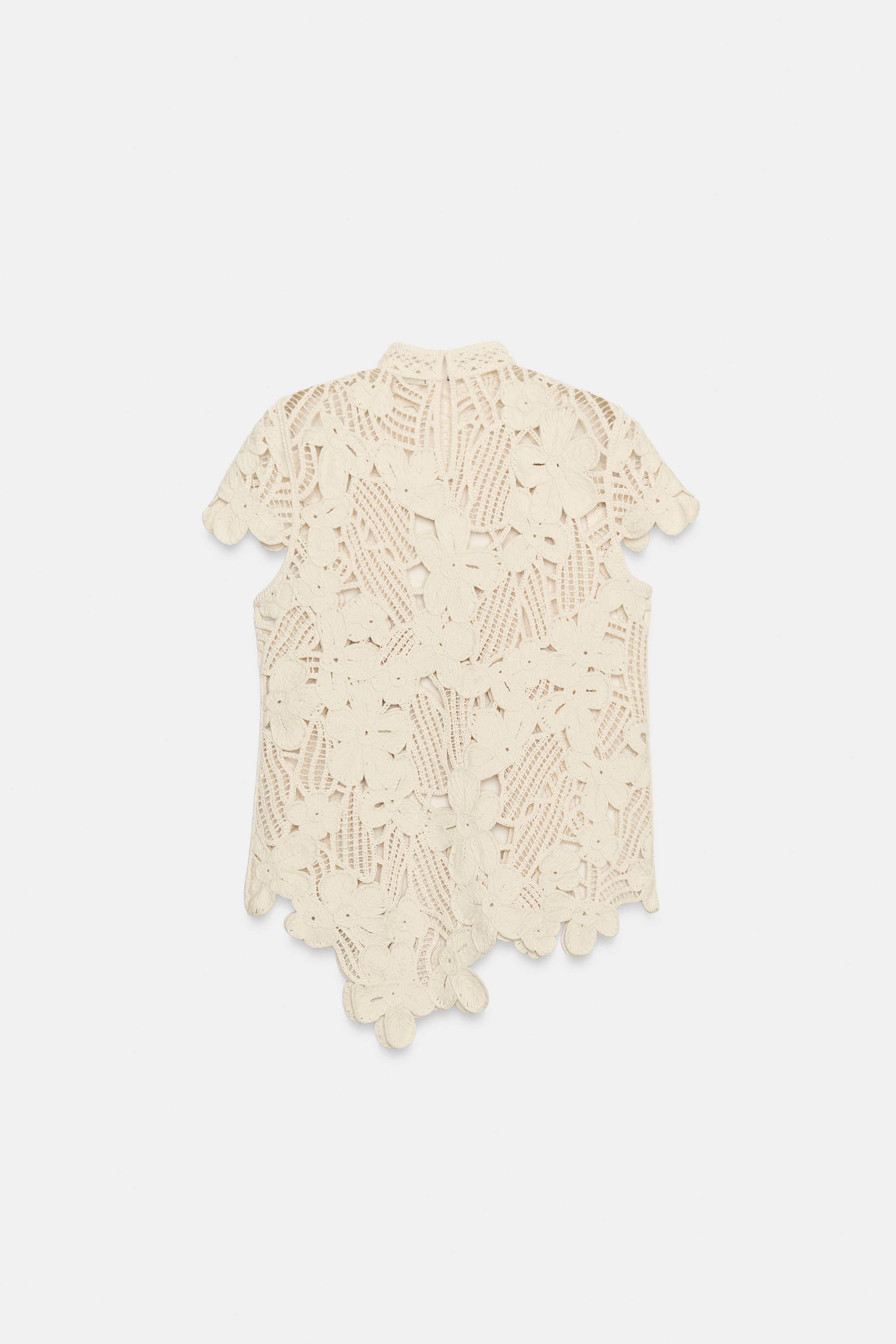 ZARA WOMAN COLLECTIONTop made of a cotton blend yarn. High neck and short sleeves. Asymmetrical h... | Zara US