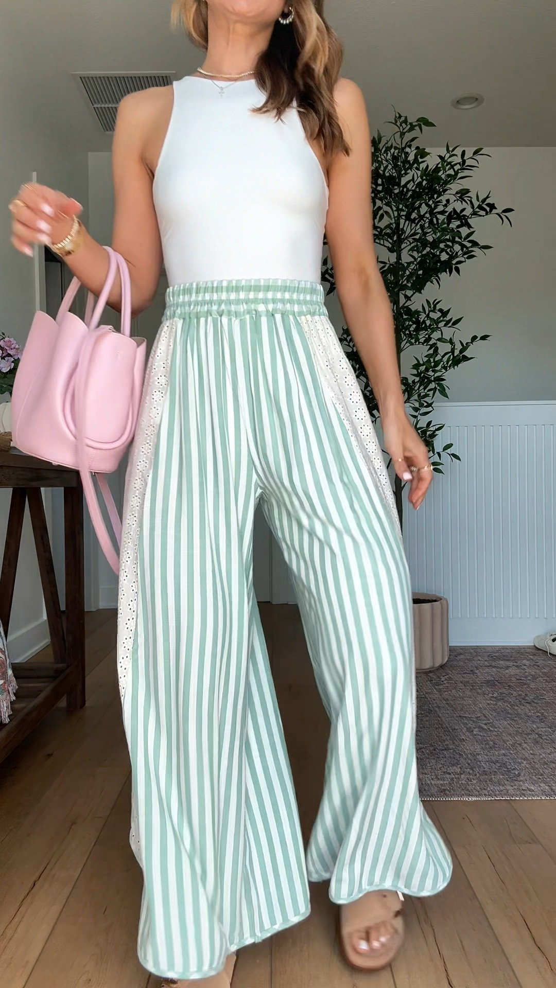 My spring outfit one day! Elevated casual outfit. Spring style. Summer outfit. Summer style. Beach pants. Vacation outfit. Love these striped crop pants from Amazon in XS! Seamless bodysuit in XS. Tulip bucket bag with removable crossbody strap and pouch for makeup inside! Buckle slide sandals are TTS and so comfy!

#LTKootd #LTKPetite #LTKTravel
