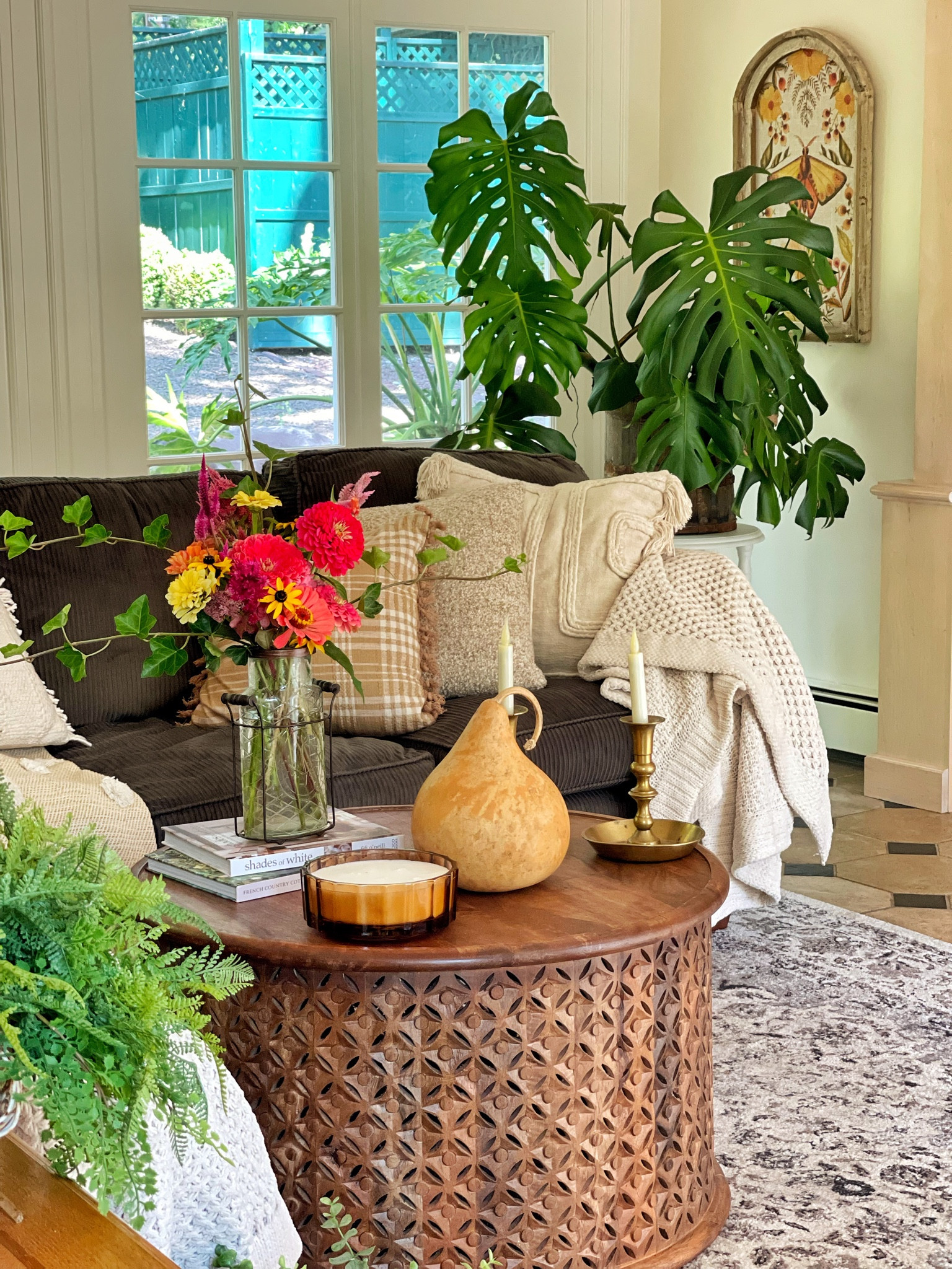 Vintage farmhouse family room in fall.
Round coffee table, area rug, wood coffee table, monstera plant, vintage linen print, sectional sofa, throw pillows, throw blankets, gourds, candles, fall decor

#LTKsalealert #LTKhome #LTKSeasonal