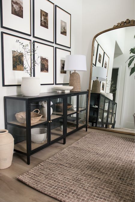 Swooning over our entryway! She’s small, but mighty! These glass cabinets really helped open up this space, and that 7’ anthro mirror is the mirror of my dreams. These black frames are out of stock, but I linked similar ones. Use code FRENGPARTY15 for 15% off this brown rug.

#LTKsalealert #LTKstyletip #LTKhome