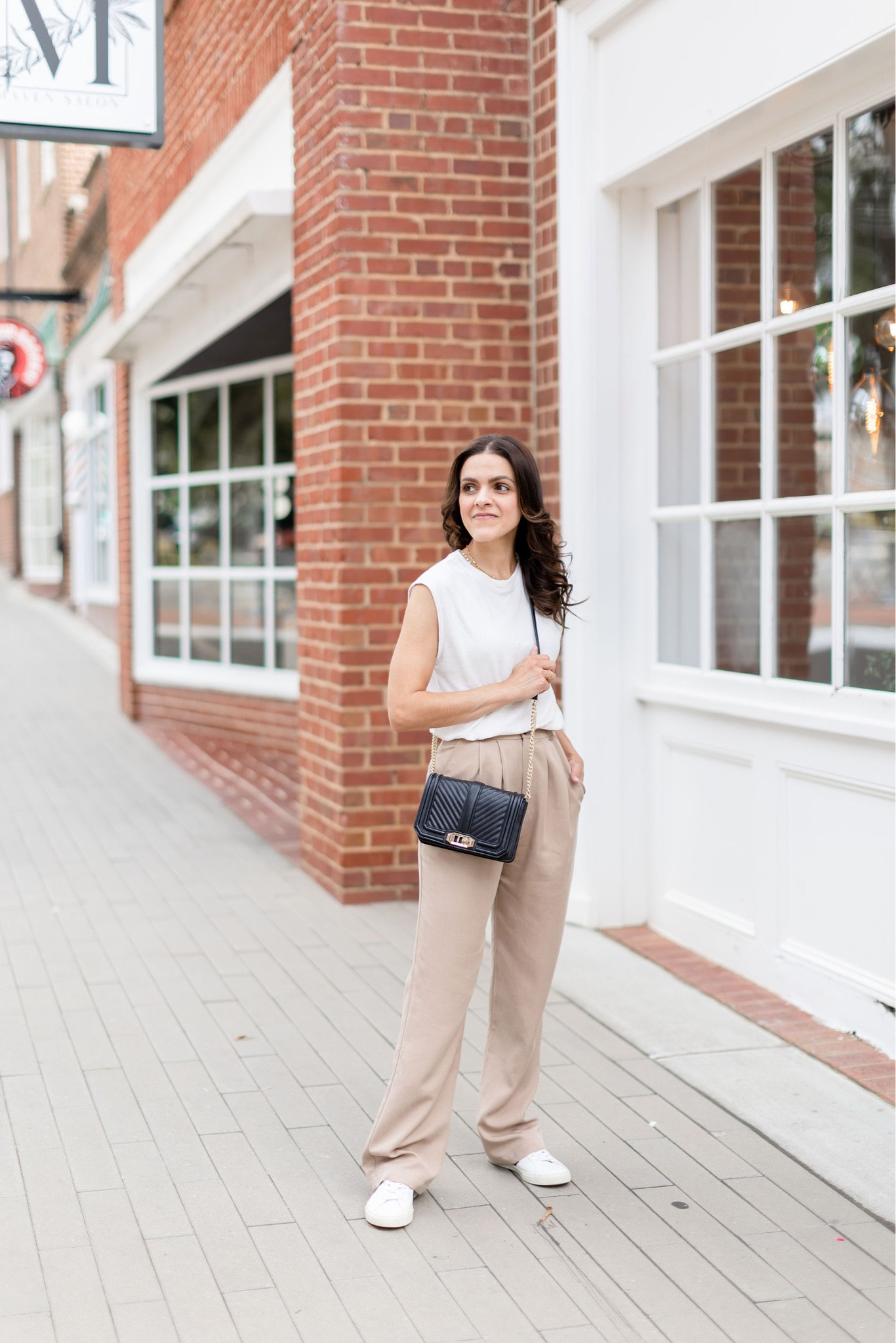 September mini capsule outfit idea: muscle tank, tan trouser, sneakers, crossbody

#LTKstyletip
