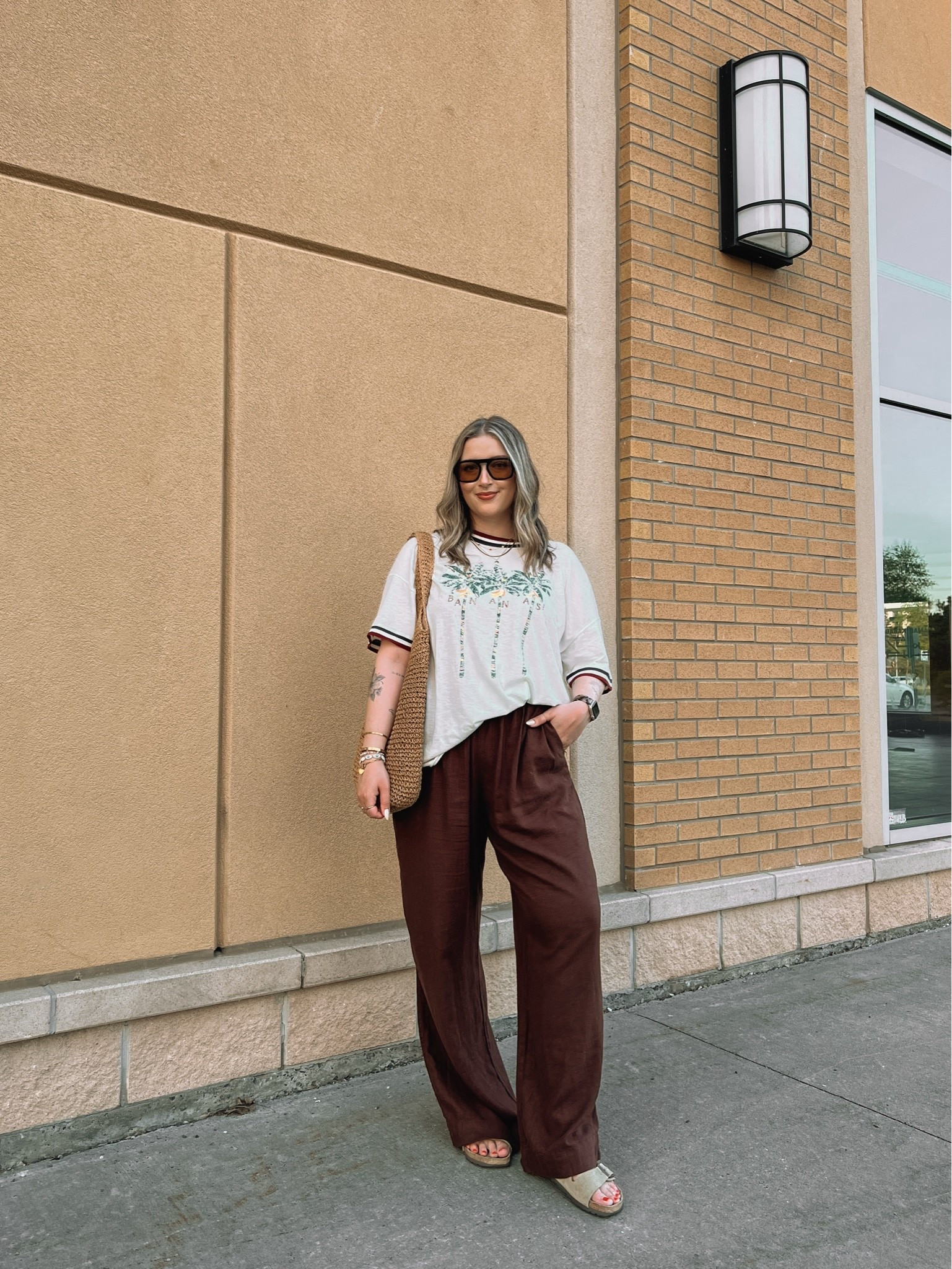 Comfy casual summer outfit! Wearing my usual size L in the graphic tee and L tall in the linen pants (Canadian pants link under “similar products”). Sunnies and straw bag are Amazon finds! Birkenstocks fit TTS

#LTKmidsize #LTKsummer #LTKsale