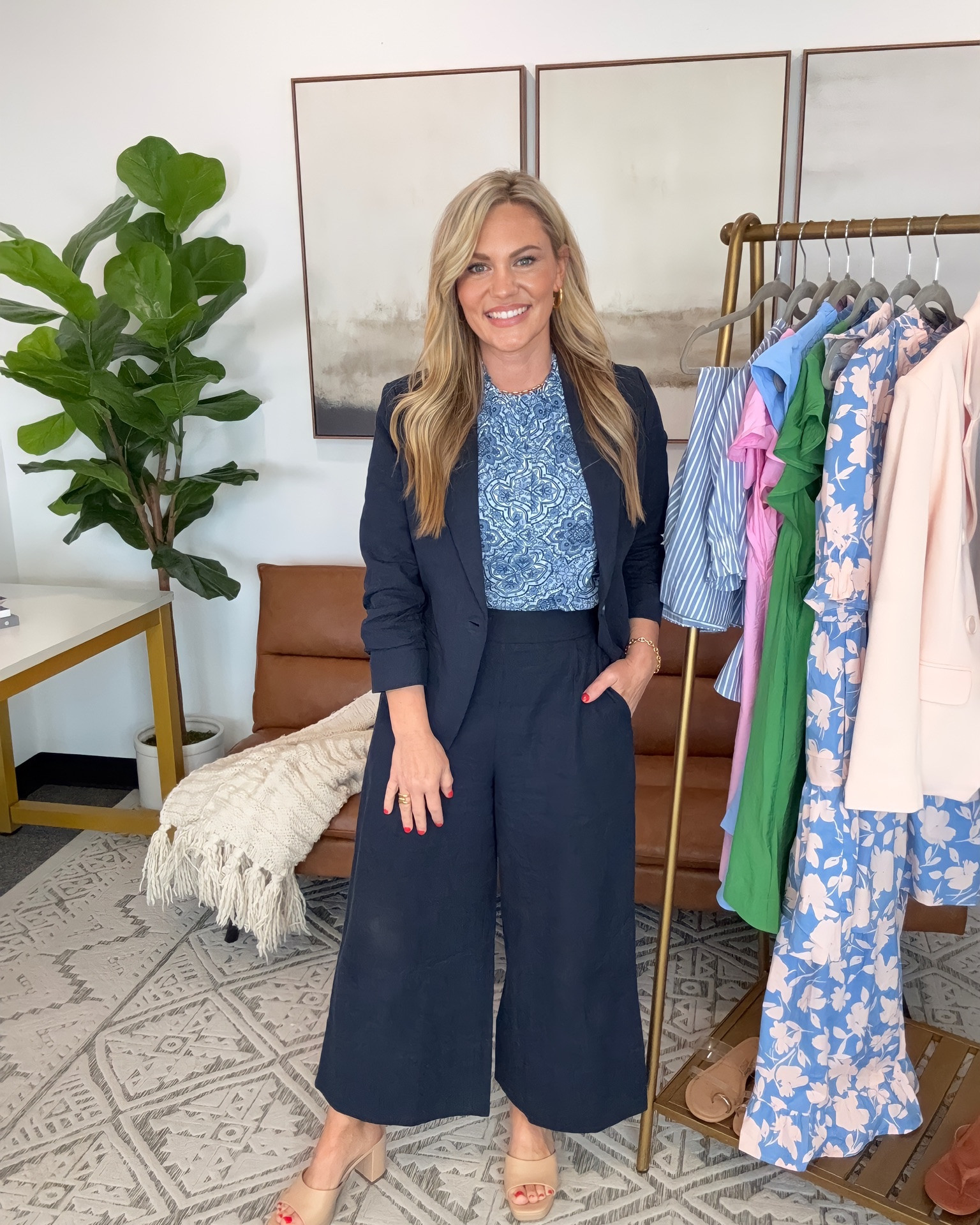 Wide leg trousers are one of the easiest ways to create polished workwear outfits while still feeling comfortable throughout the day. These navy Gibsonlook trousers paired with the floral flutter sleeve blouse create a softer business casual look, and the matching navy blazer adds structure for meetings, conferences, office wear, and more professional settings. Each piece also works separately within a capsule wardrobe, making it easy to build additional outfits with denim, skirts, white trousers, or basic layering pieces.

Top: Small
Pants: Small
Blazer: Small
Shoes: 7.5
Bra Size: 34DD
Height: 5’2

gibsonlook  blazer outfit  workwear outfit  business casual outfit  office outfit ideas  wide leg trousers  navy blazer outfit  matching blazer set  teacher outfit  conference outfit  professional style  floral blouse outfit  spring workwear  petite workwear  capsule wardrobe pieces  polished office style  mix and match outfits  AudrieDollins

#LTKWorkwear #LTKOver40 #LTKootd