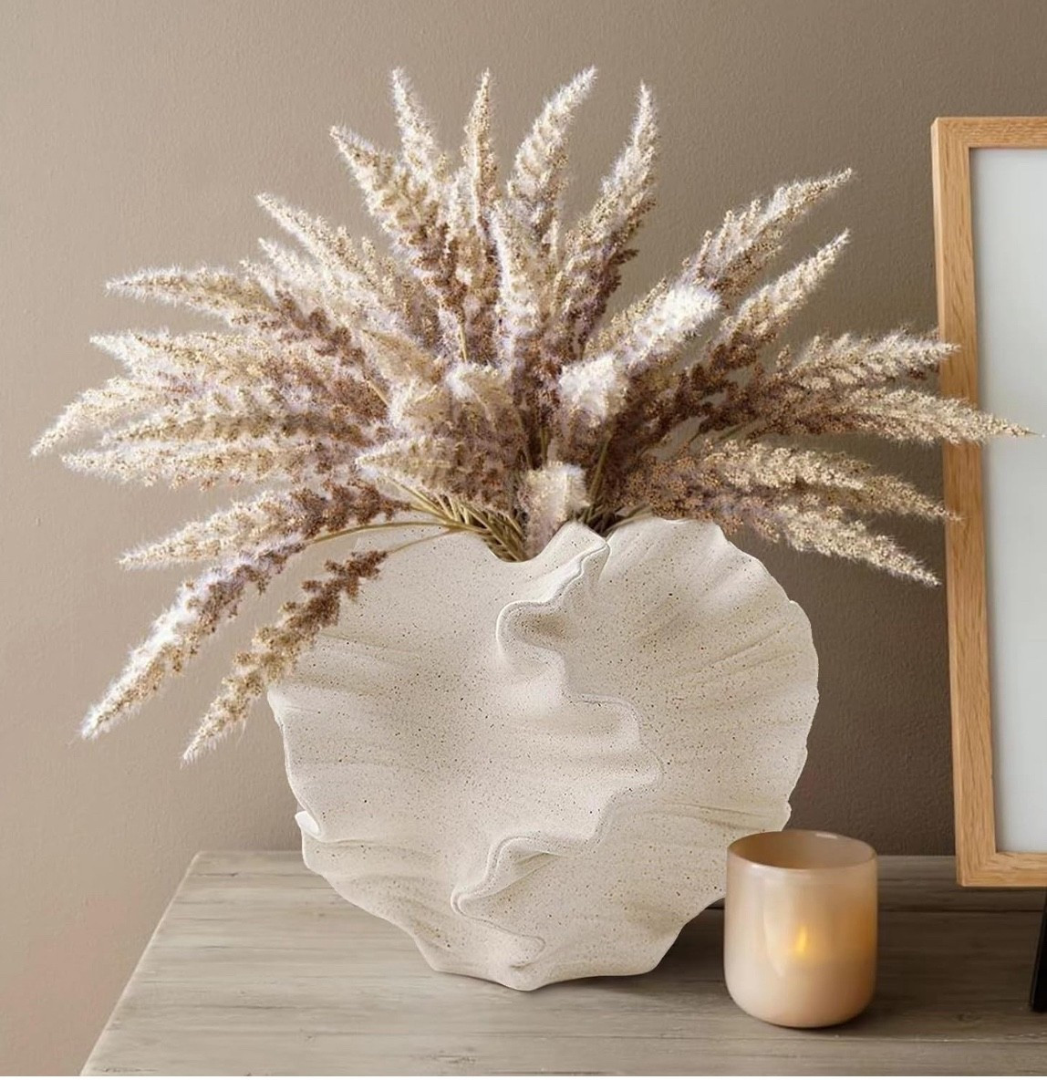 Obsessed with this sculptural vase + pampas combo 🤍 It’s the perfect neutral statement piece for any space! Linked it all for you on my LTK—go grab yours before it’s gone! #HomeDecor #LTKFinds #NeutralVibes #DecorGoals