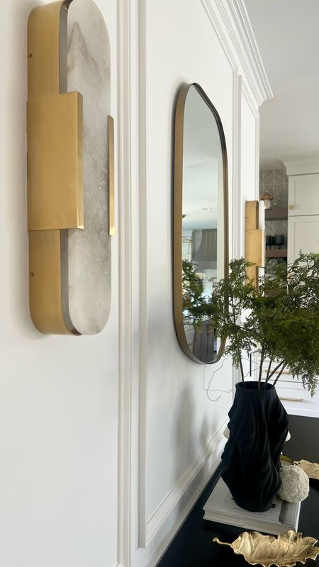 These sconces are both a work of art and functional mood lighting. 

Wall decor. Wall lighting. Brass lighting. Kelly Wearstler. Wall mirror. Brass decor. Good decor. Transitional decor  

#LTKhome #LTKstyletip