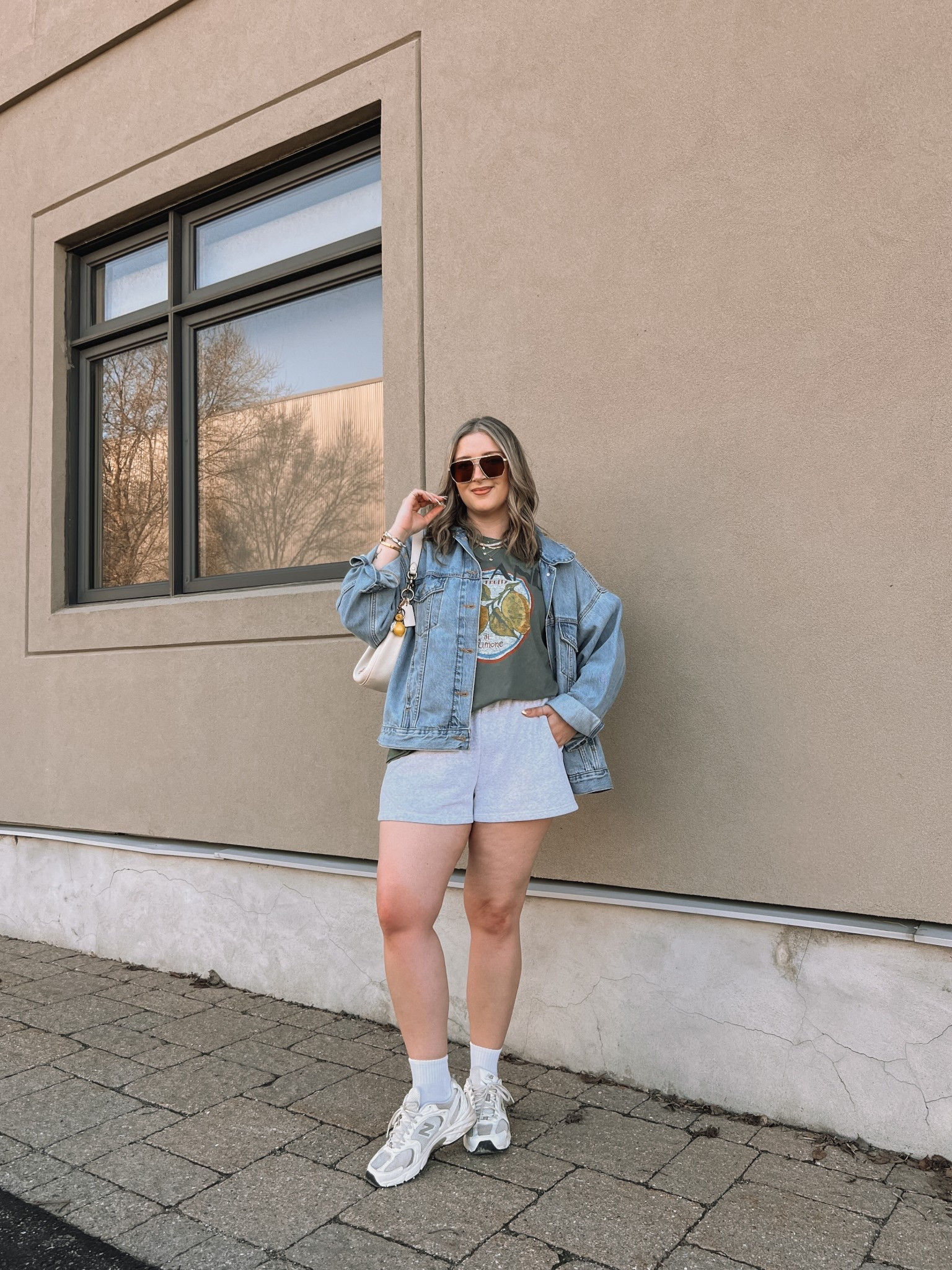 Comfy casual spring to summer outfit! Wearing my usual size L in the sweatshorts and graphic tee. Sized up to XL in the denim jacket, also linked similar. New Balance dad sneakers run a little big, I’m a 9.5-10 and wear a 9

#LTKmidsize #LTKsale #LTKsummer