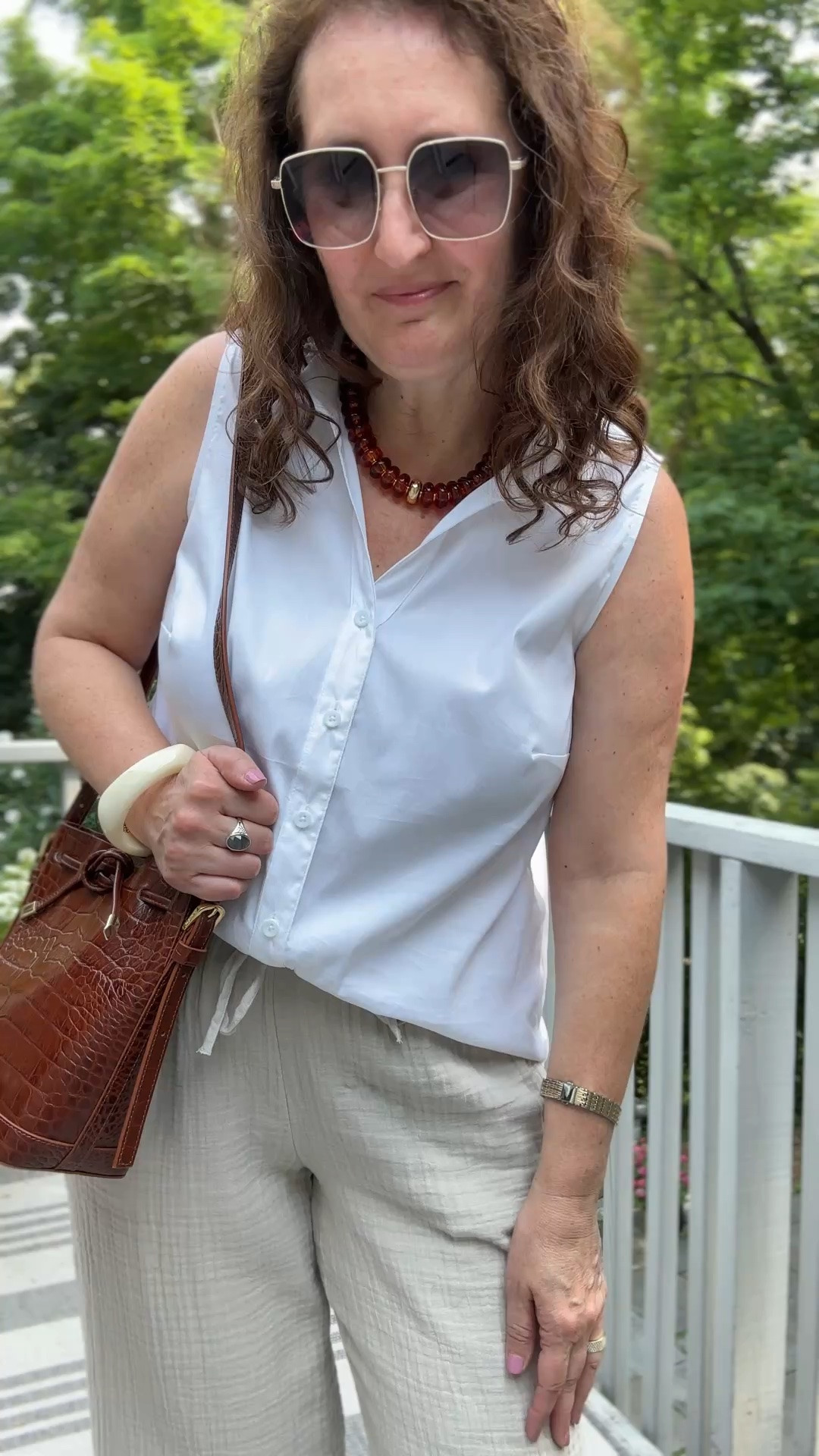Sleeveless white shirt and gauze pants, beaded jewelry, chunky bangle bracelet

#LTKdayinmylife #LTKootd #LTKMidsize