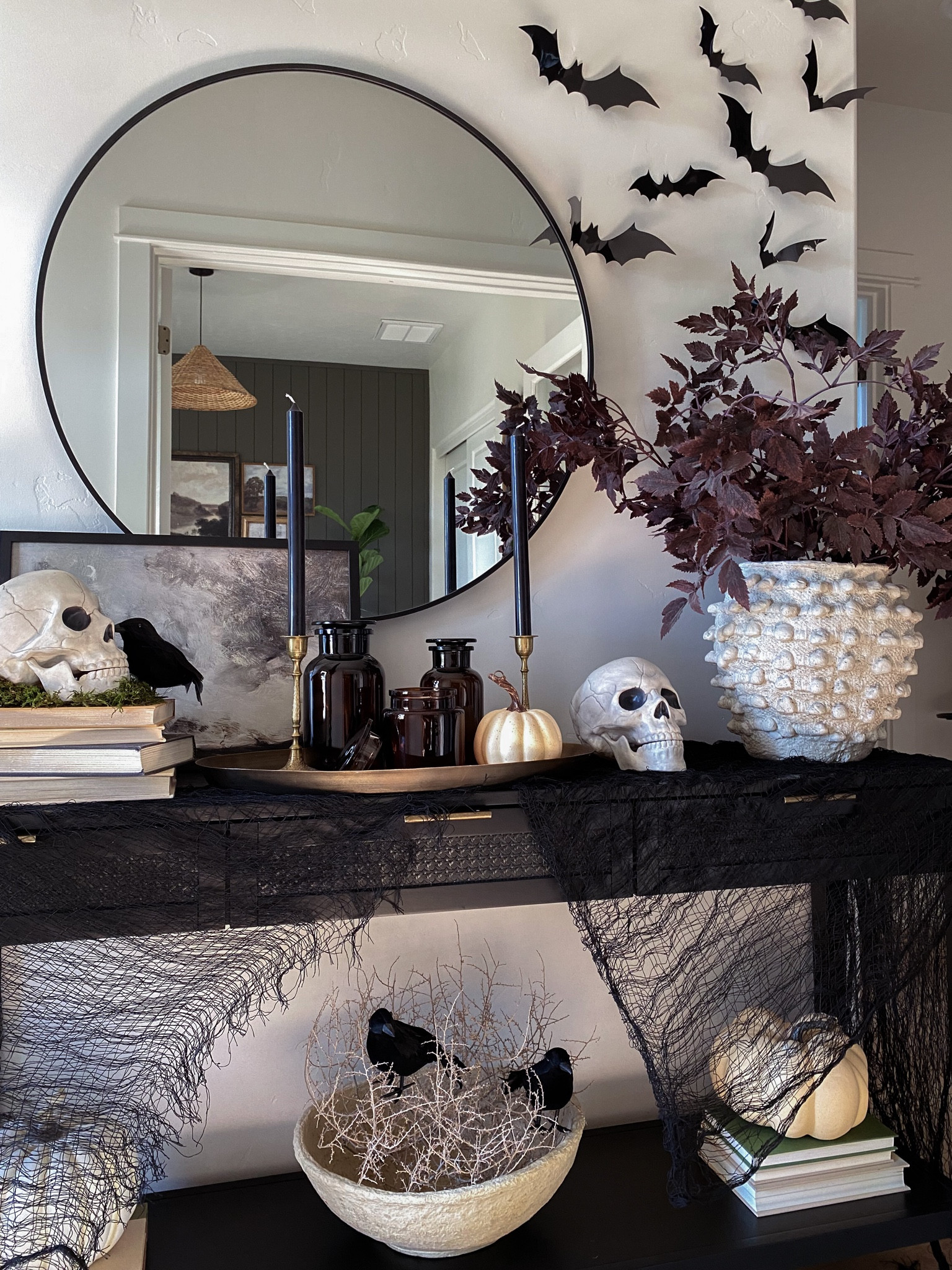 Halloween decor, Halloween ideas, fall decor, entryway ideas, spooky season, black console table, minka pot, large white pot, burgundy fall stem,  round wall mirror, skulls, black gauze, black crows, Amazon finds, 

#LTKstyletip #LTKSeasonal #LTKhome