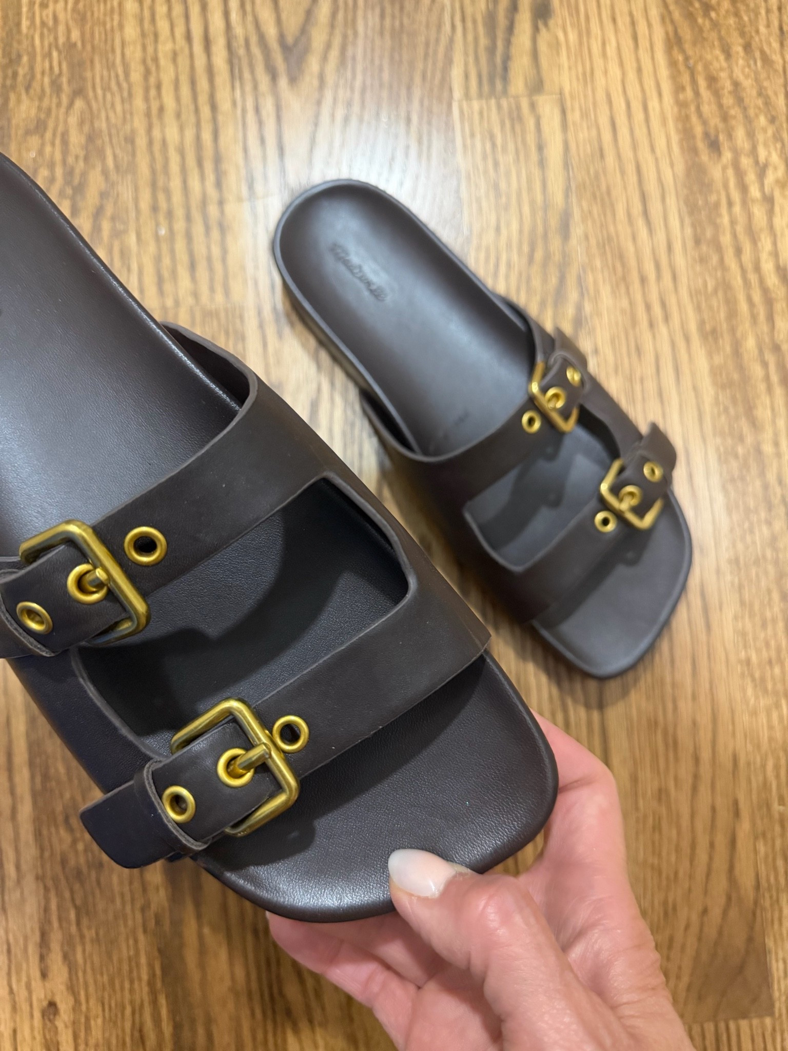 True to size, I actually was in the middle and sized down. LOVE THE COLOR & the gold detail.
