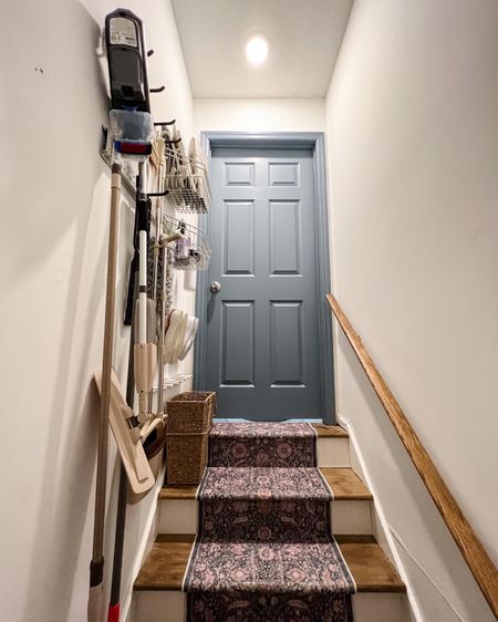 The top of basement stairs is typically unused, but when you add some wall storage you can actually fit quite a bit there! I spray painted these rails and hooks from Walmart, then loaded them down with cleaning supplies. And the coat hooks worked out perfectly for dirty shoe storage. 🙌🏼 This may be the most organized basement stairs ever!

#LTKSeasonal #LTKhome #LTKfamily