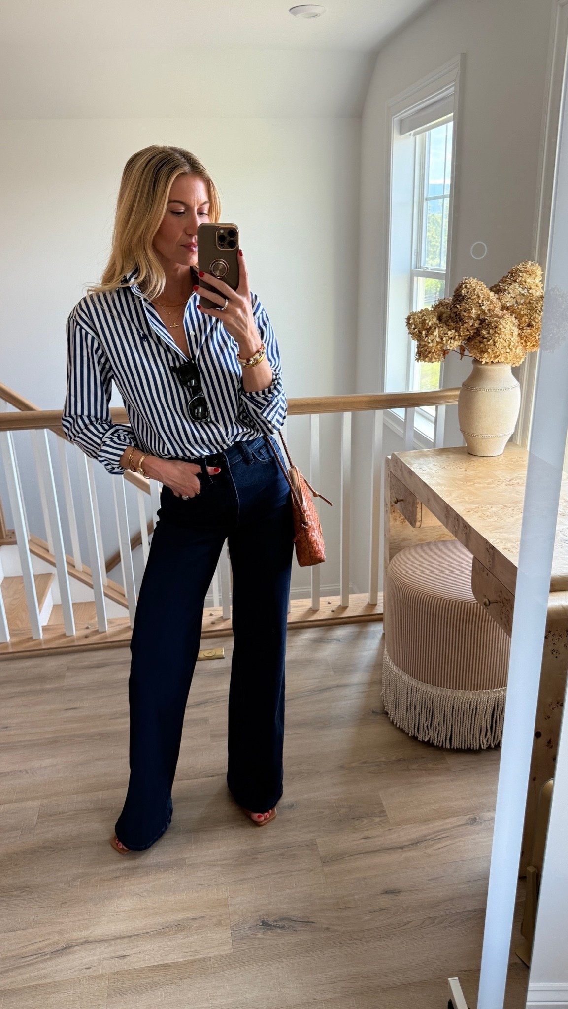 Classic striped button up with some of the most flattering high-rise, wide leg denim jeans that I own. Striped Ralph Lauren button up: TTS, wearing a S Dark denim high-rise wide leg jeans: TTS, wearing a 25 Cognac Brown kitten mule sandals: TTS Woven cognac Brown Crossbody bag, Ray-Ban black sunglasses, classic style

#LTKootd #LTKgrwm #LTKdayinmylife