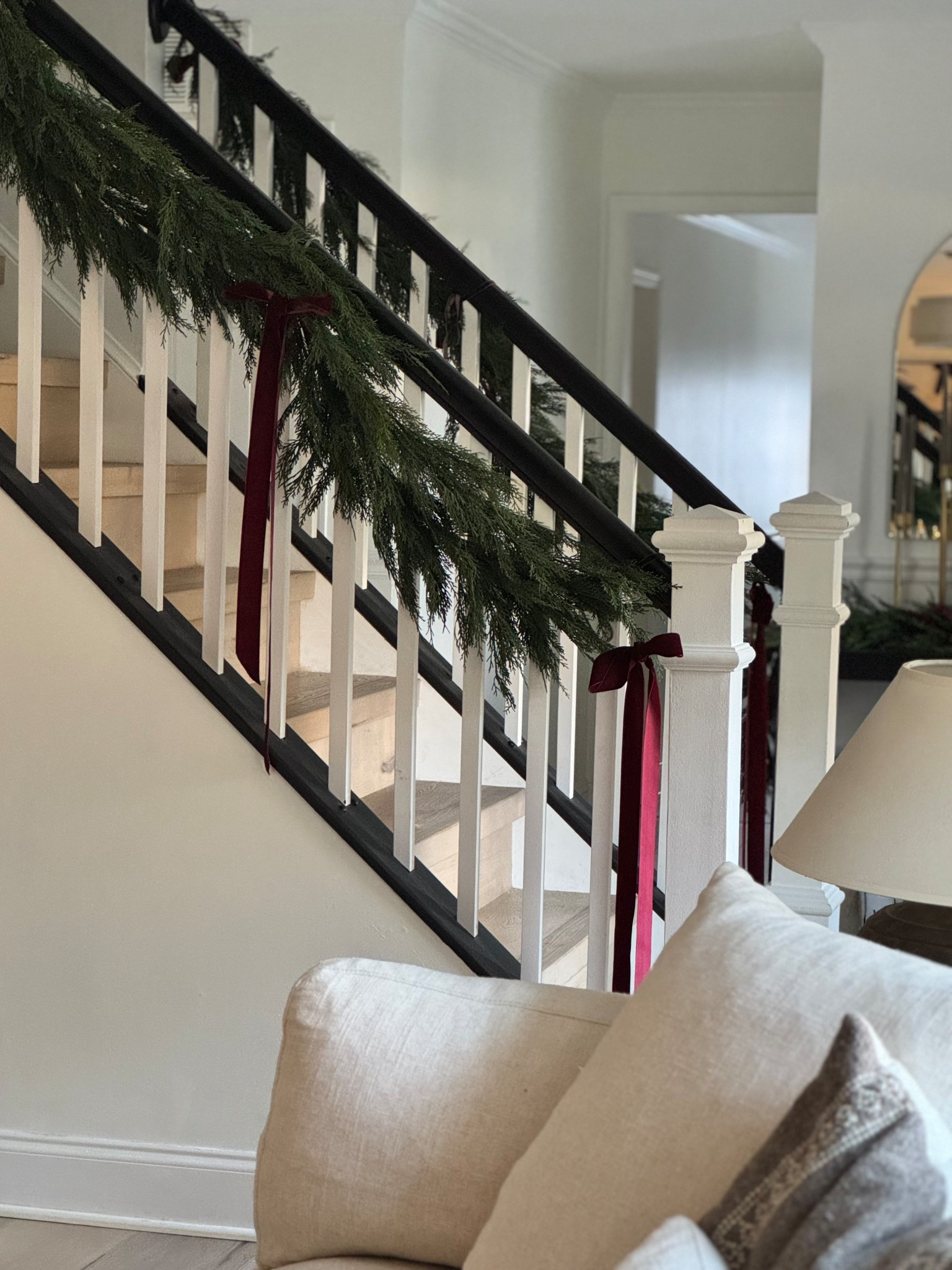 Simple staircase garland. I went minimal with just one strand on each side. 

#LTKHoliday