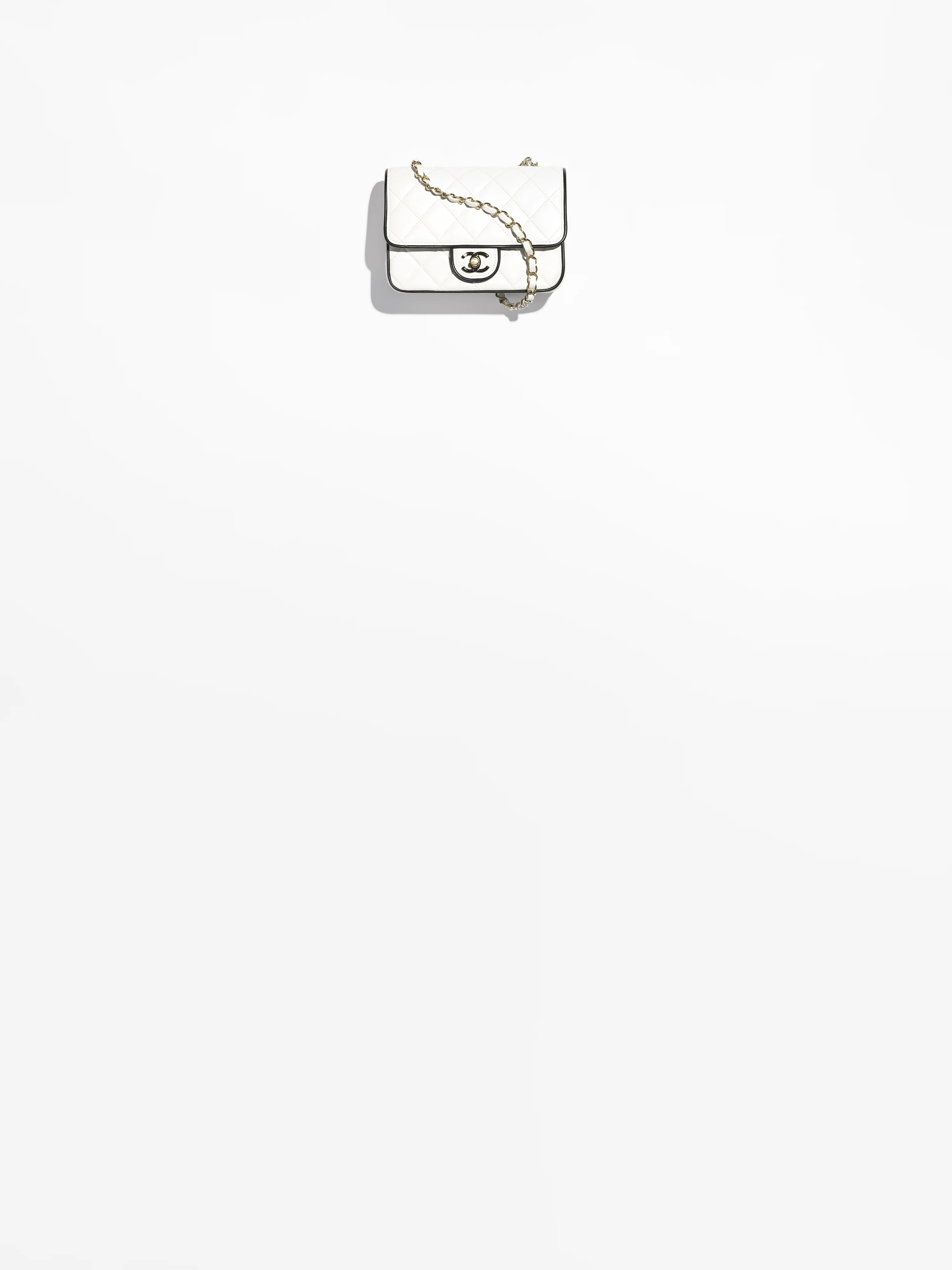 Mini flap bag, Lambskin & gold-tone metal, white & black — Fashion | CHANEL | Chanel, Inc. (US)
