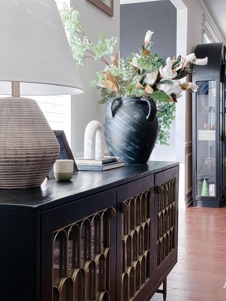 Shop this look and style your sideboard with the pottery barn rustic vase, faux stems, studio McGee lamp, studio McGee marble arch and nix digital photo frame 🙌🏼

#LTKstyletip #LTKhome #LTKfamily