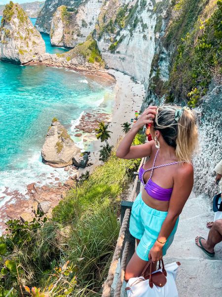 #Summeroutfit. #Beachlook. #summerlook
#vacationlook
#beachvacation
#beachwear
#bikini
#cutoutbikini  #dior #sunglasses
Purple bikini top. Cross bikini top. Cutout bikini top. Blue shorts. Turquoise shorts. Sunglasses. #Whitetote . #fashioninspiration #stylingideas




#LTKfit #LTKstyletip #LTKtravel