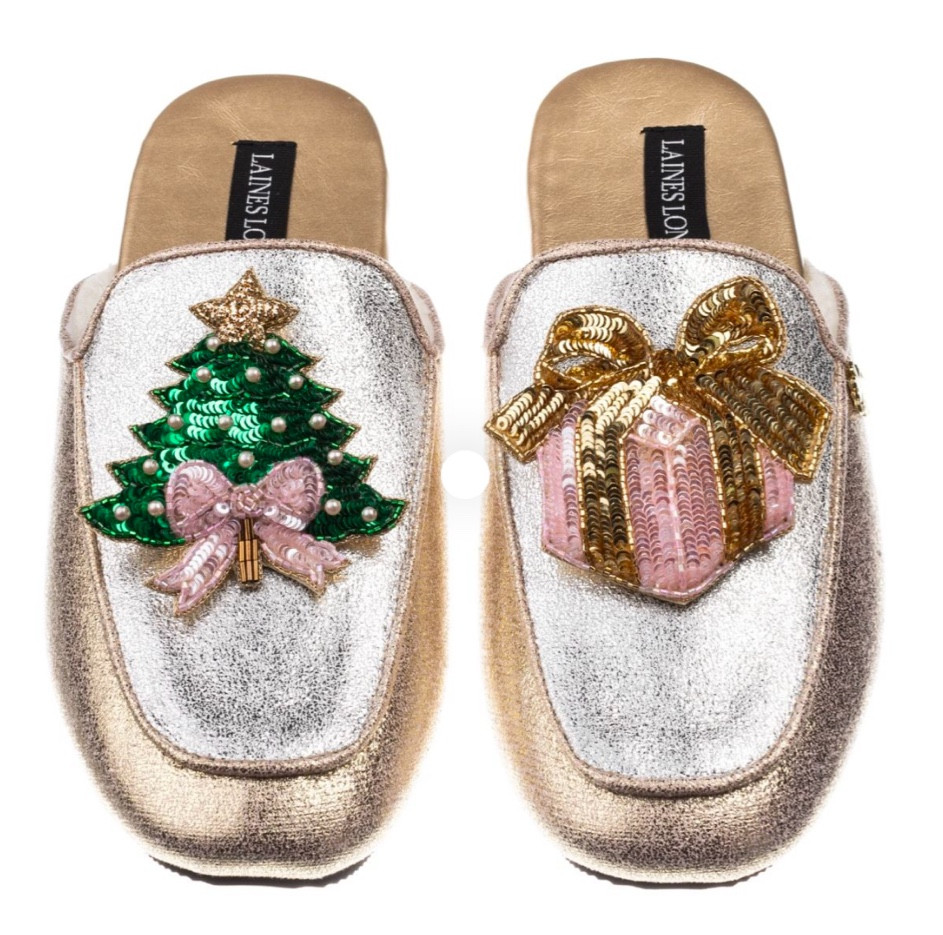 Classic Mules With Christmas Tree & Gift Brooches - Silver & Gold

Indulge in ultimate luxury with Laines London, where sophistication meets comfort.
Our classic mules are adorned with a handmade brooch, meticulously designed in-house and crafted by our skilled artisan team.
The handmade brooches can be removed from your footwear and worn on other items such as clothing and accessories.

#LTKGiftGuide #LTKParties #LTKHoliday